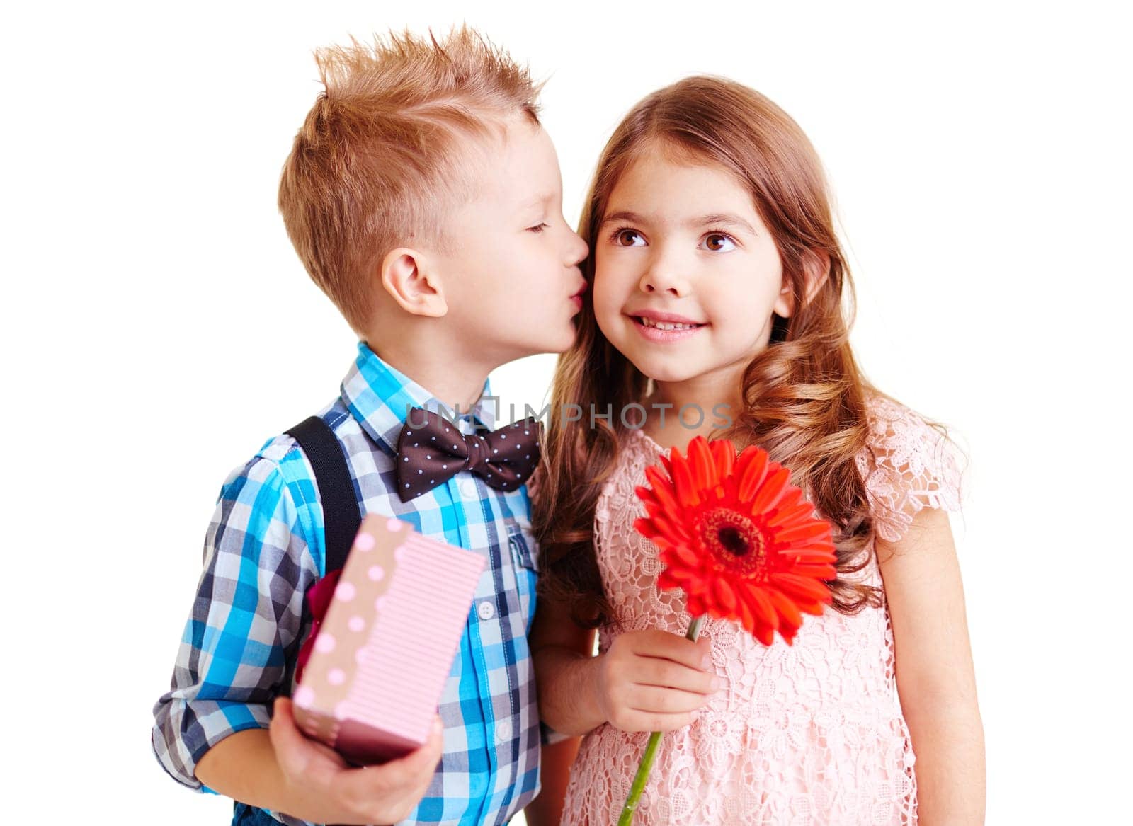 Little boy kissing hi girlfriend