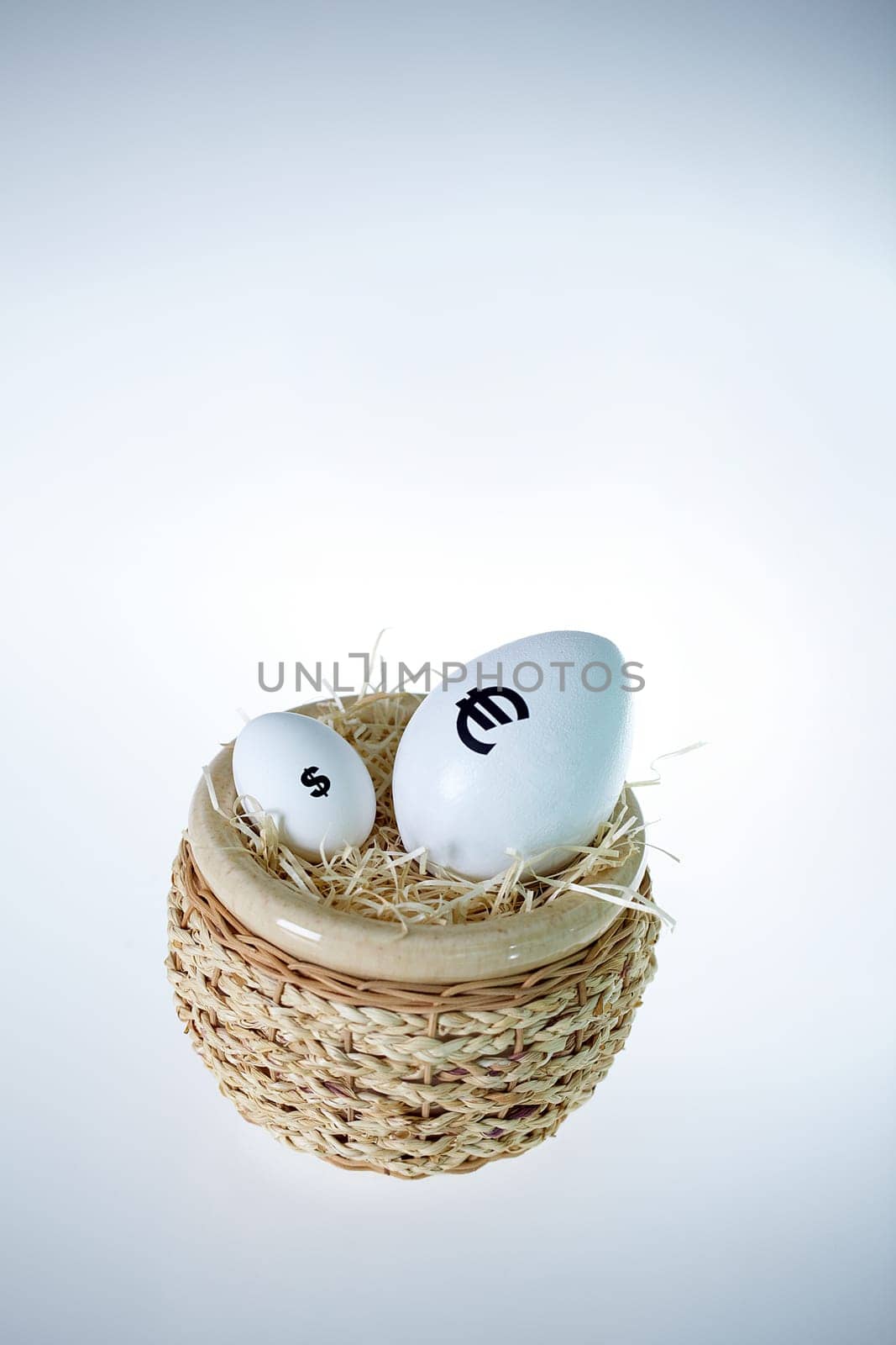 Eggs with different currency signs in one basket