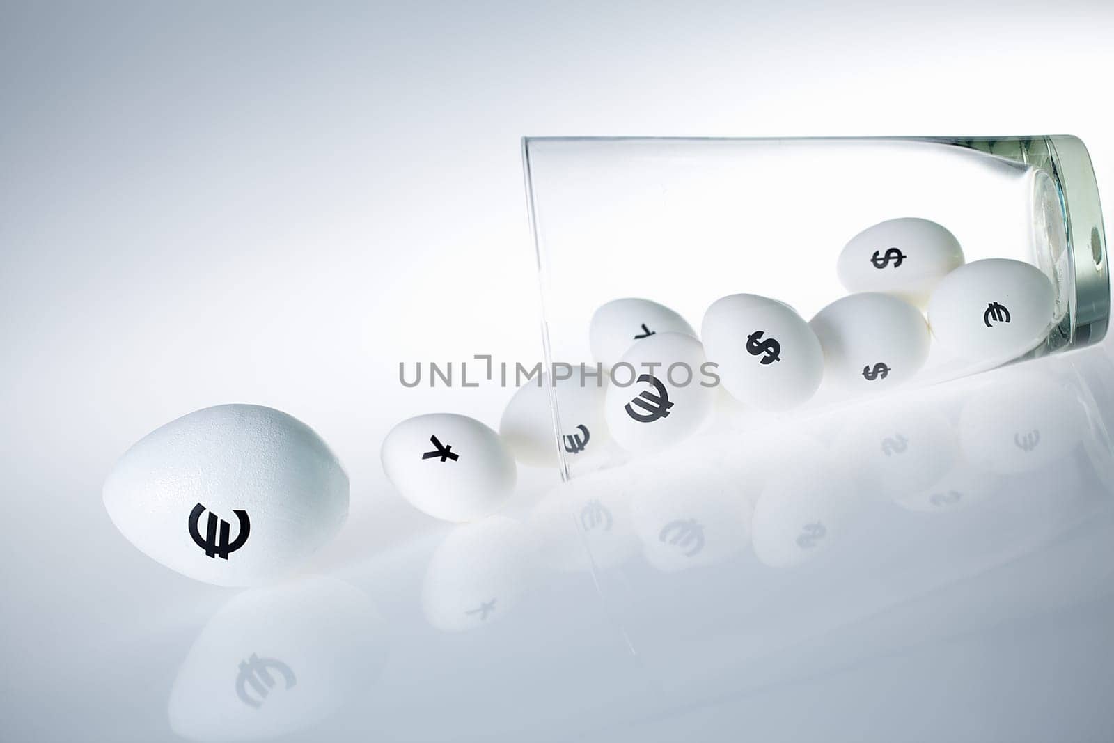 Eggs with currencies rolling to nowhere