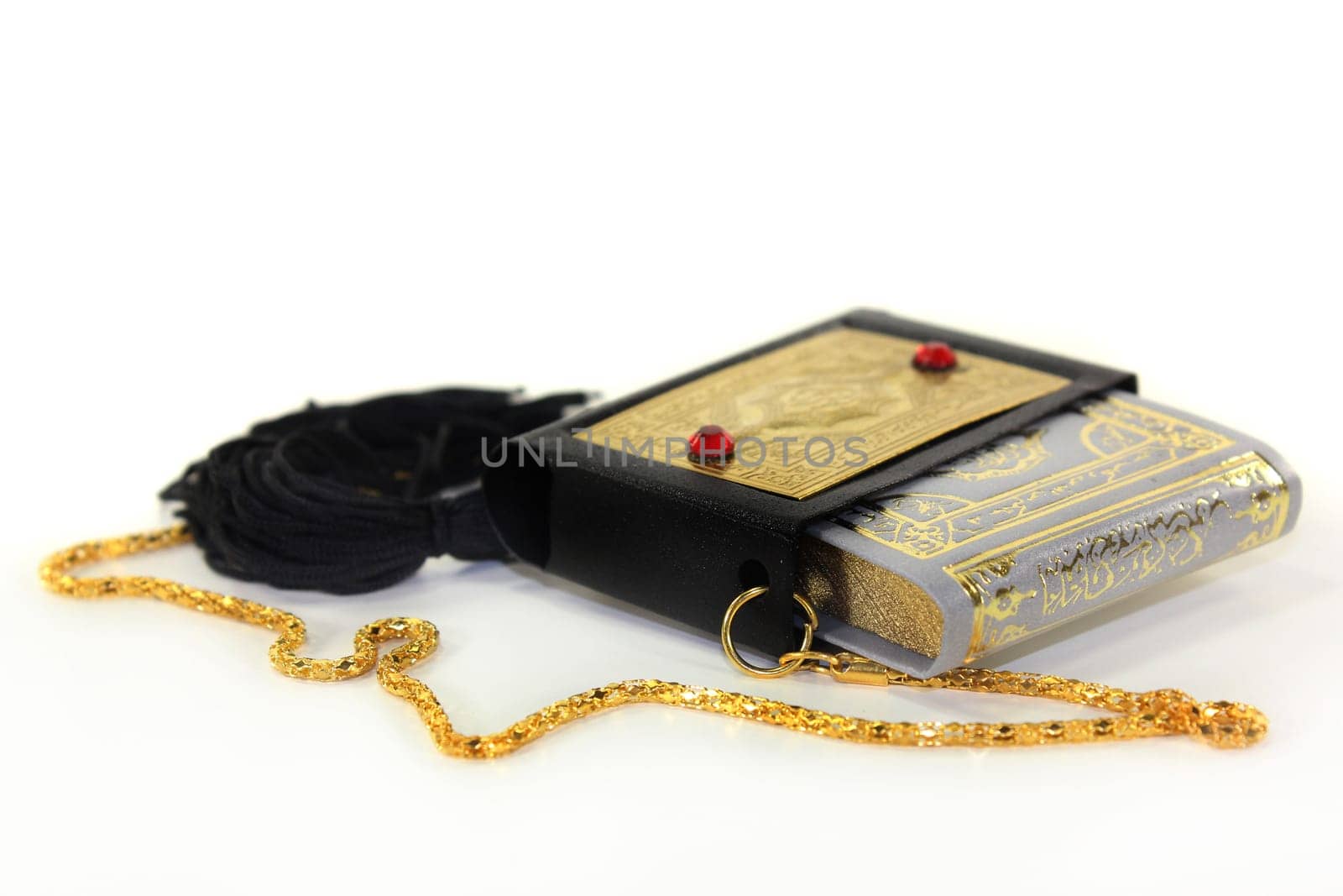 a Koran with a cover and chain