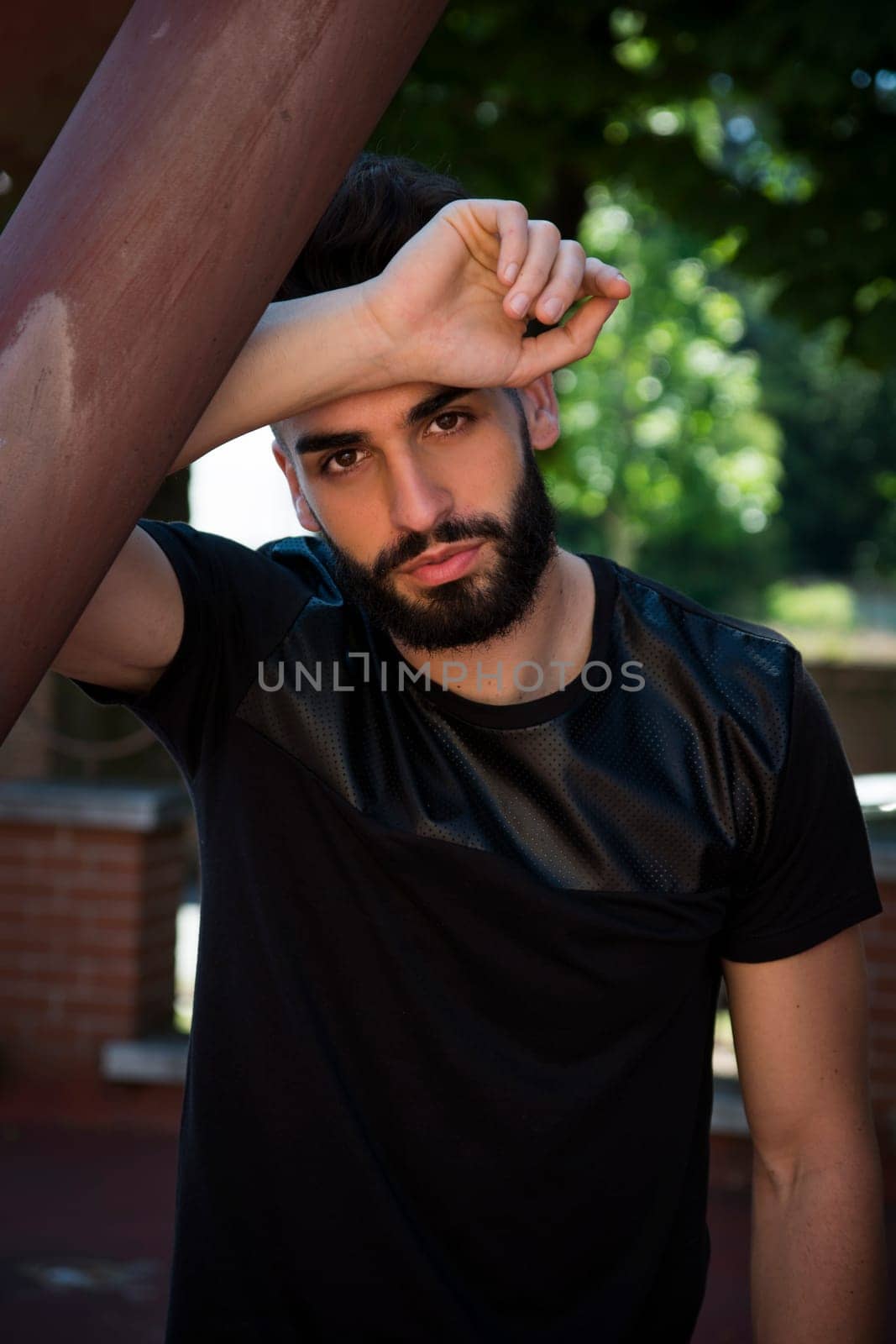 Handsome young man with beard looking at camera