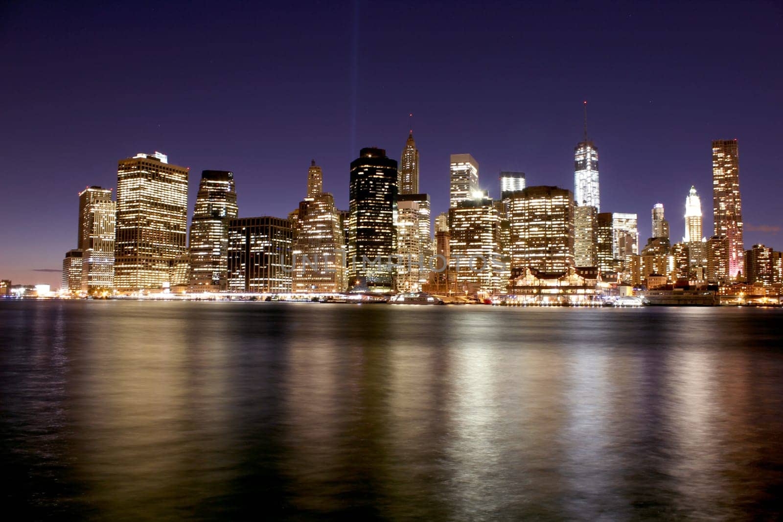 Twilight as the sun sets over Lower Manhattan. Famous New York landmarks.