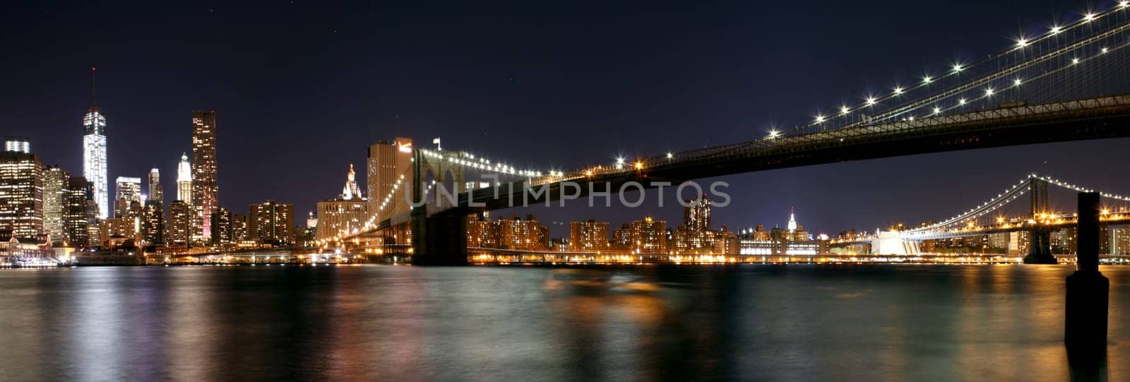 Twilight as the sun sets over Lower Manhattan. Famous New York landmarks.