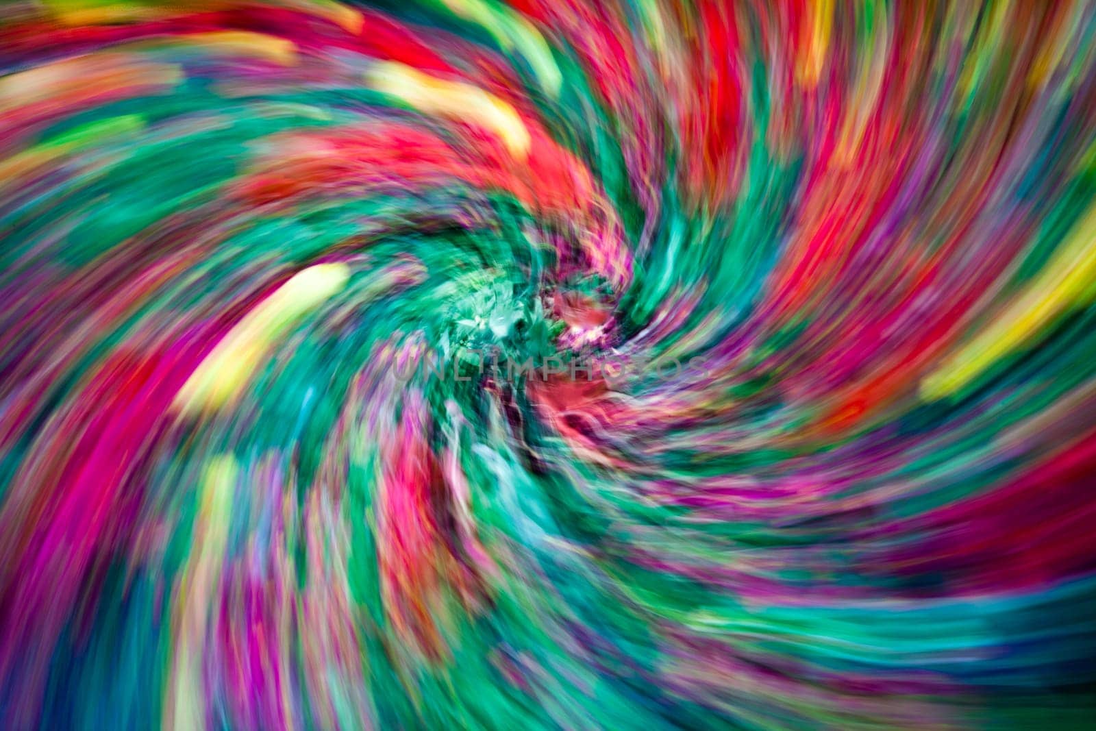 Abstract photo of multicoloured flowers on the ground in the park in spring