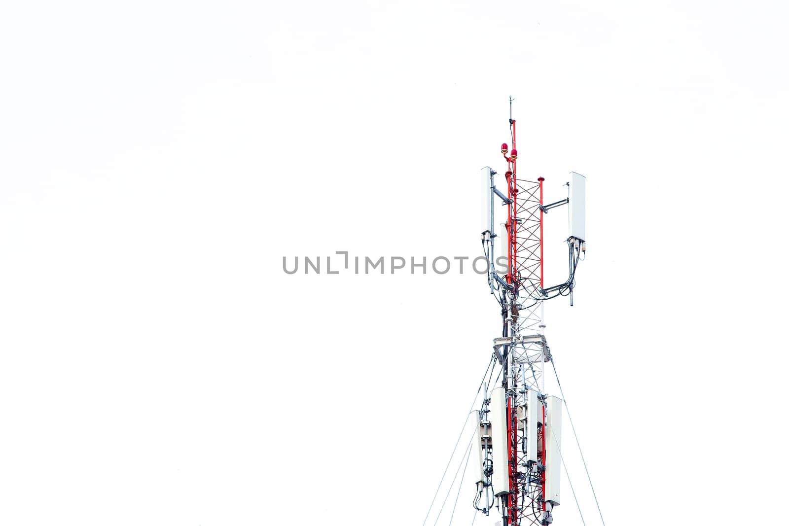 Mobile phone communication tower transmission  signal with blue sky background and antenna