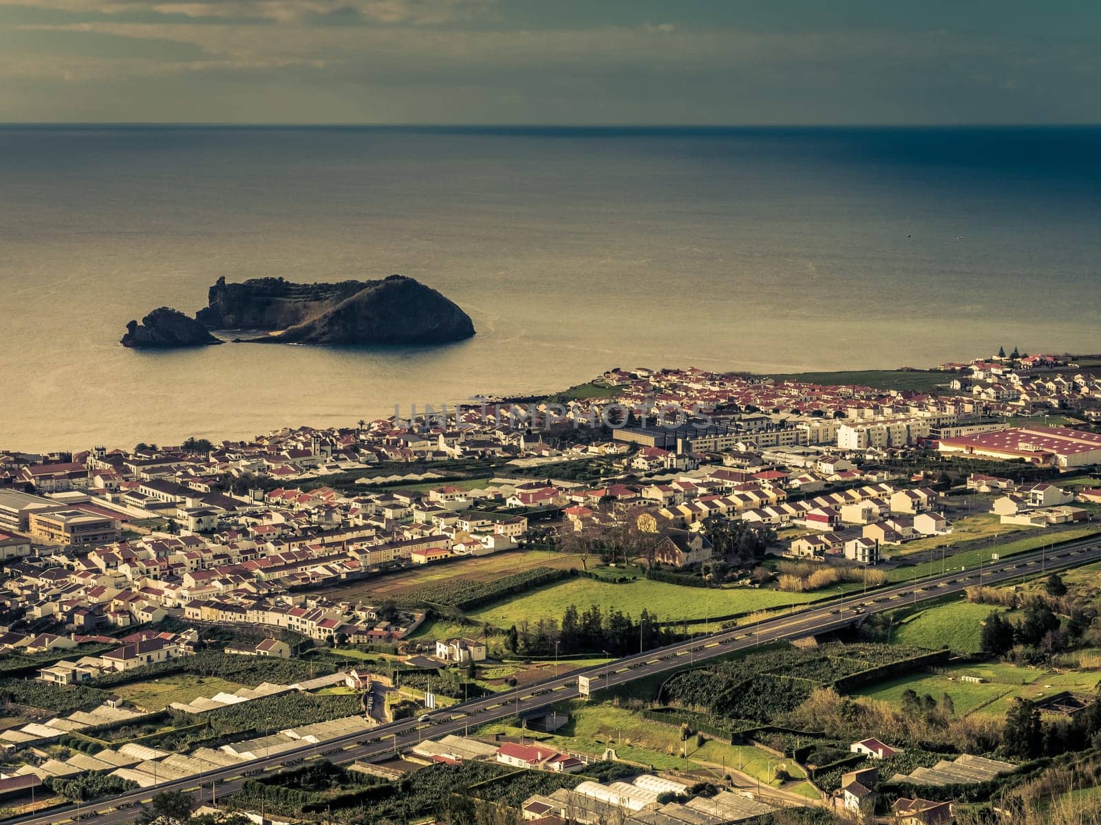 View of the small Ilheu da vila island which a popular summer retreat for people in Vila Franca do Campo in Sao Miguel Island in the Azores.
