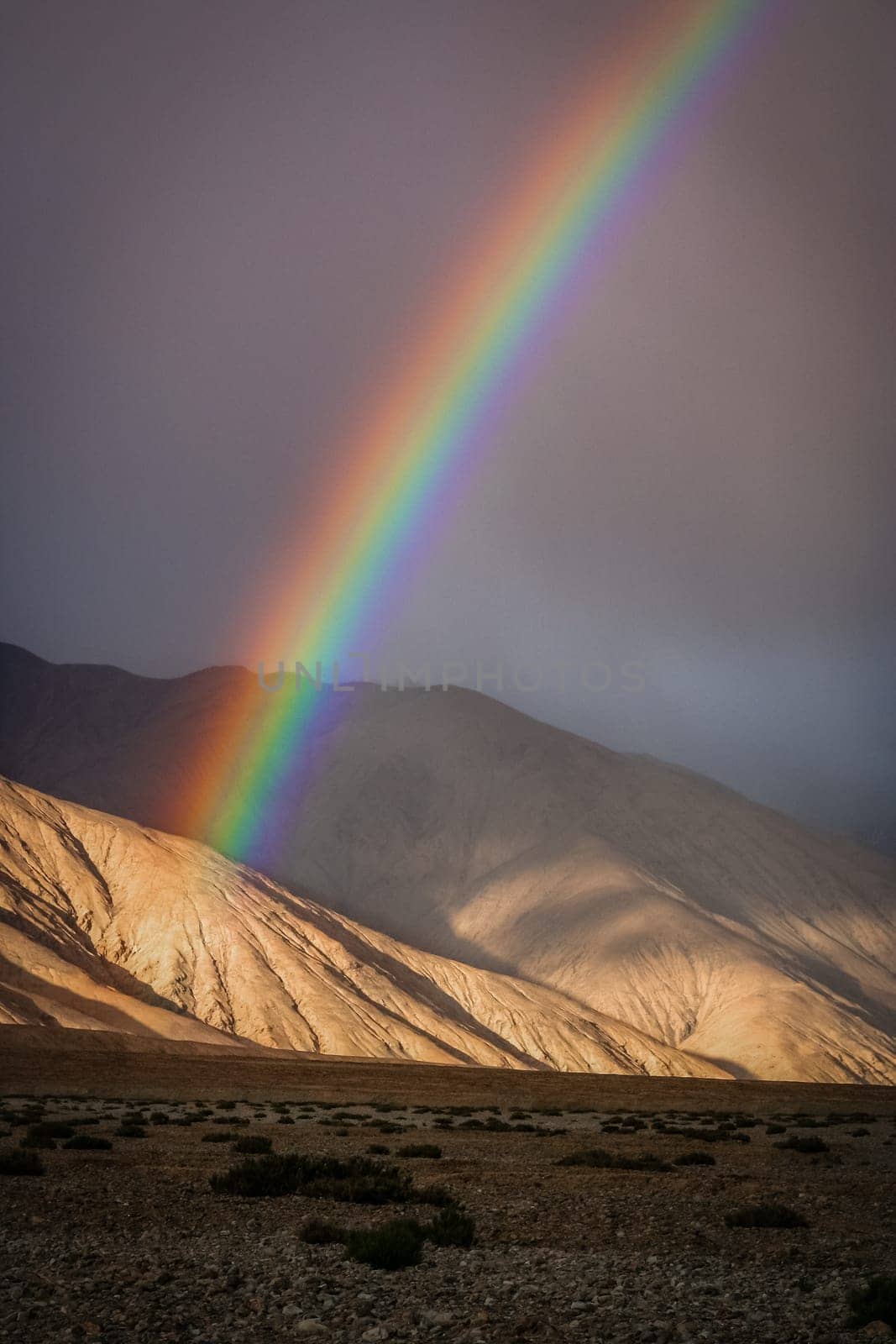 Colorful rainbow over mountains in Western Tibet