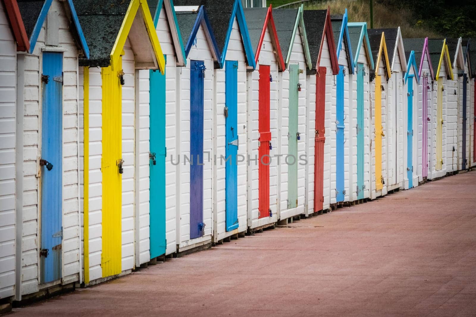 Row of colourful beach huts in Paignton, Devon, England