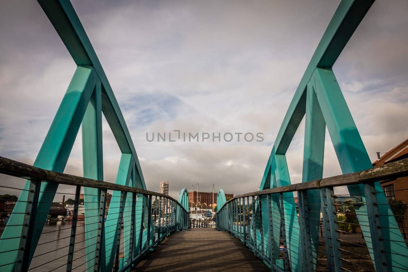 Green steel bridge in Bristol harbour, England, UK
