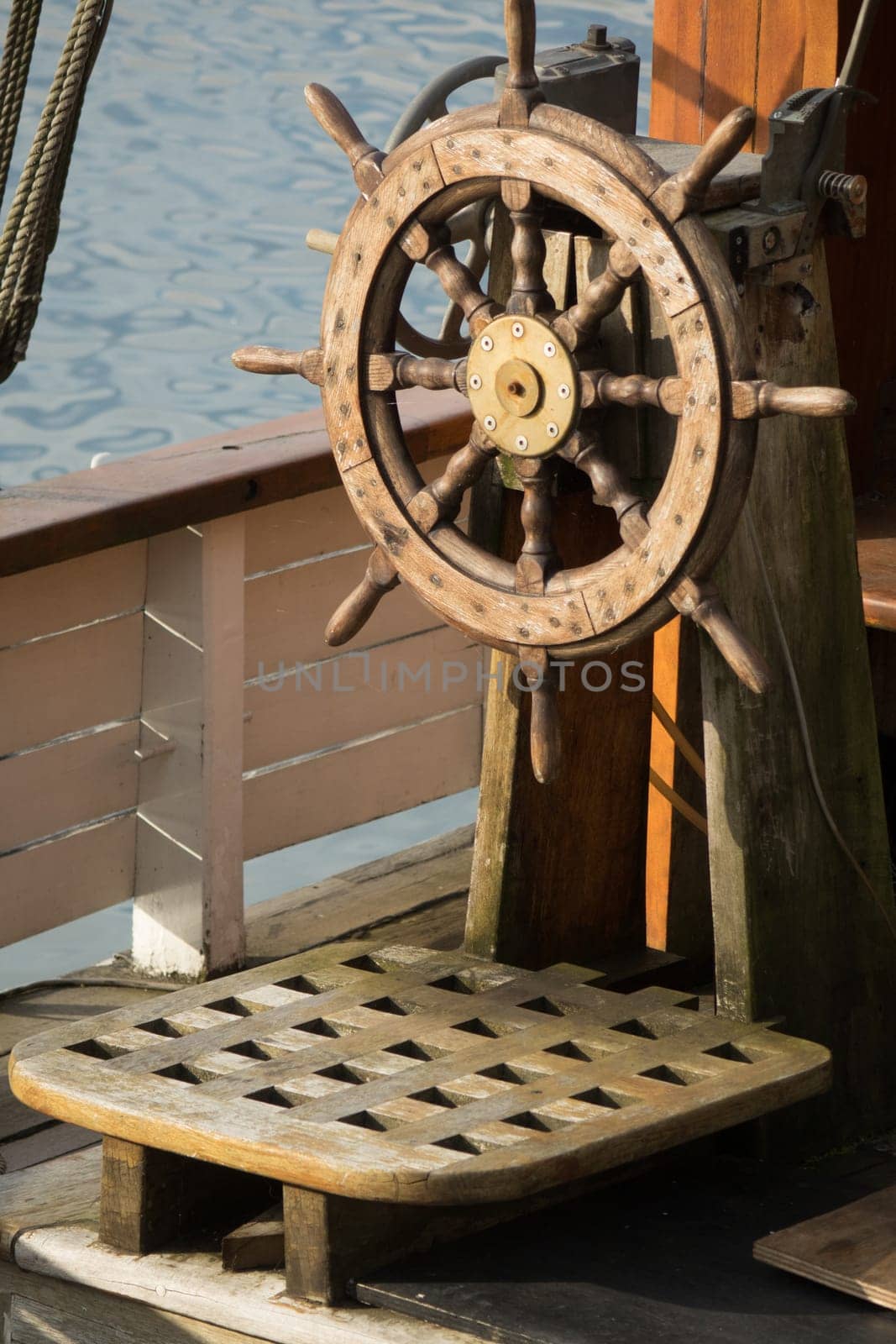 Wooden steering wheel on an old ship