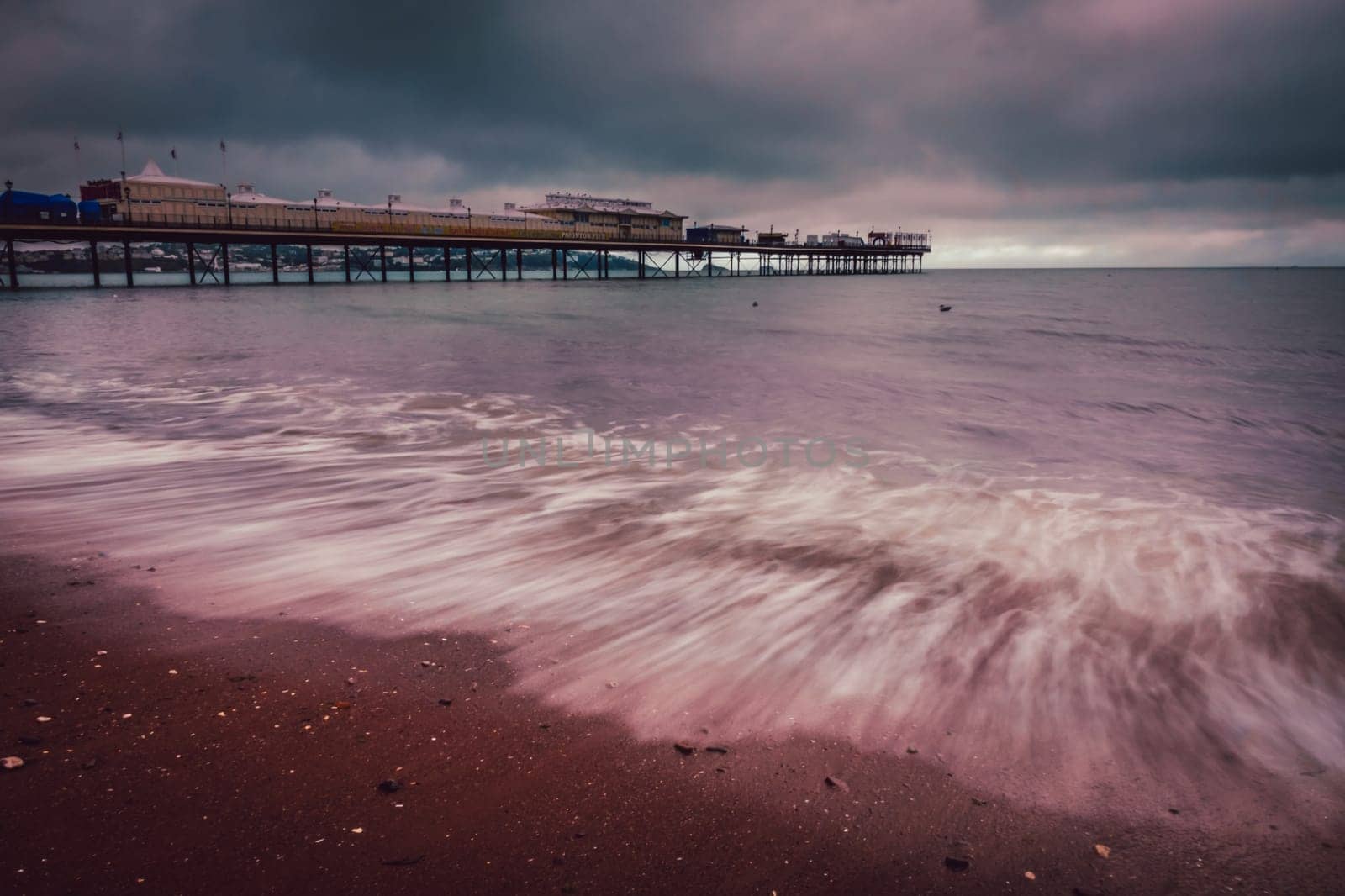 Pier on Paignton beach near Torquay in Devon on a stormy day