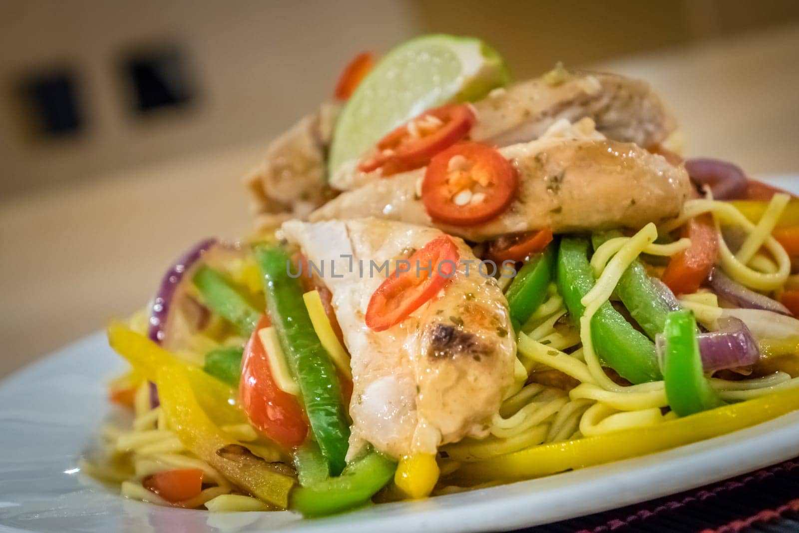 Oriental grilled chicken meal vegetables and noodles