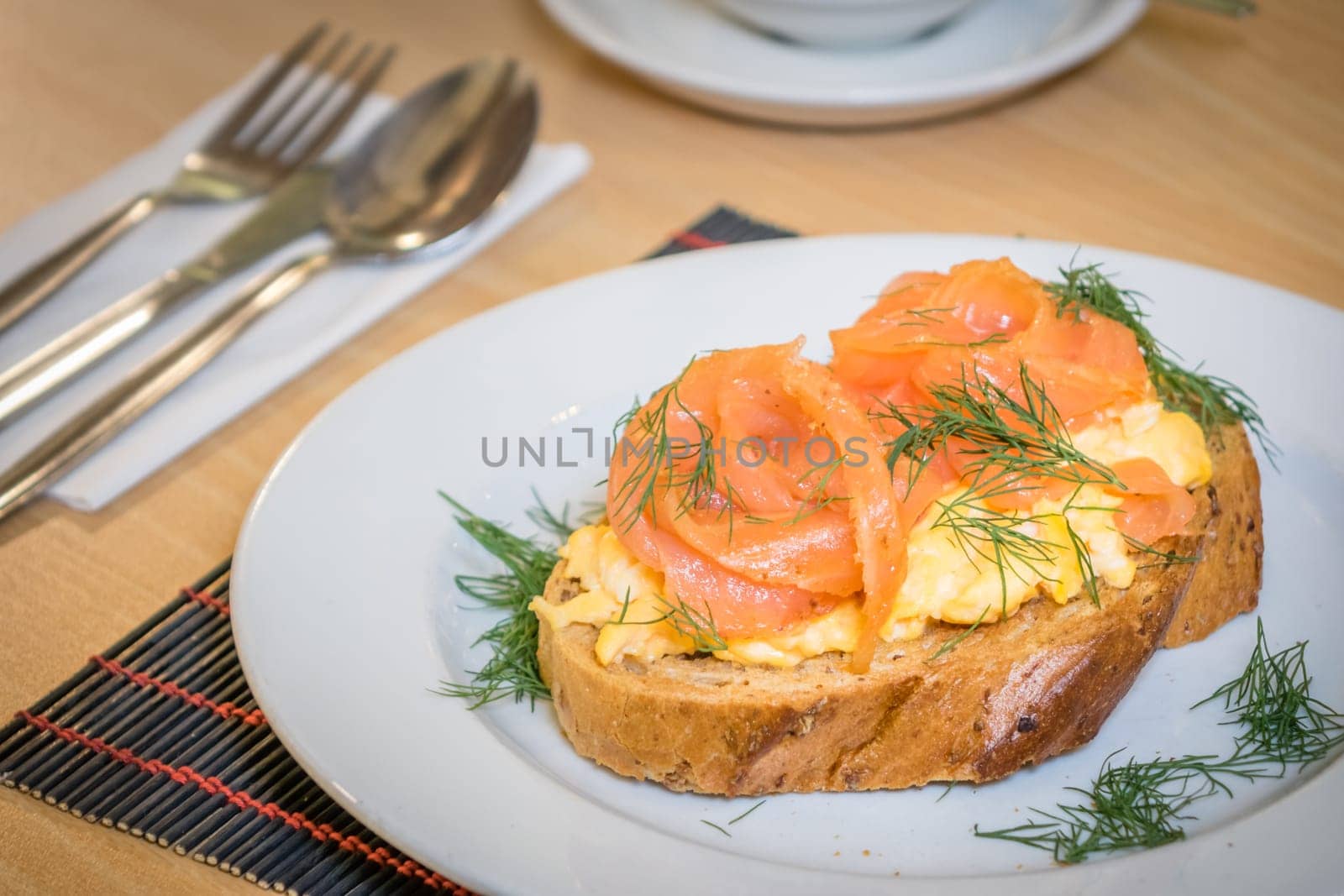 Smoked salmon with scrambled eggs on toast