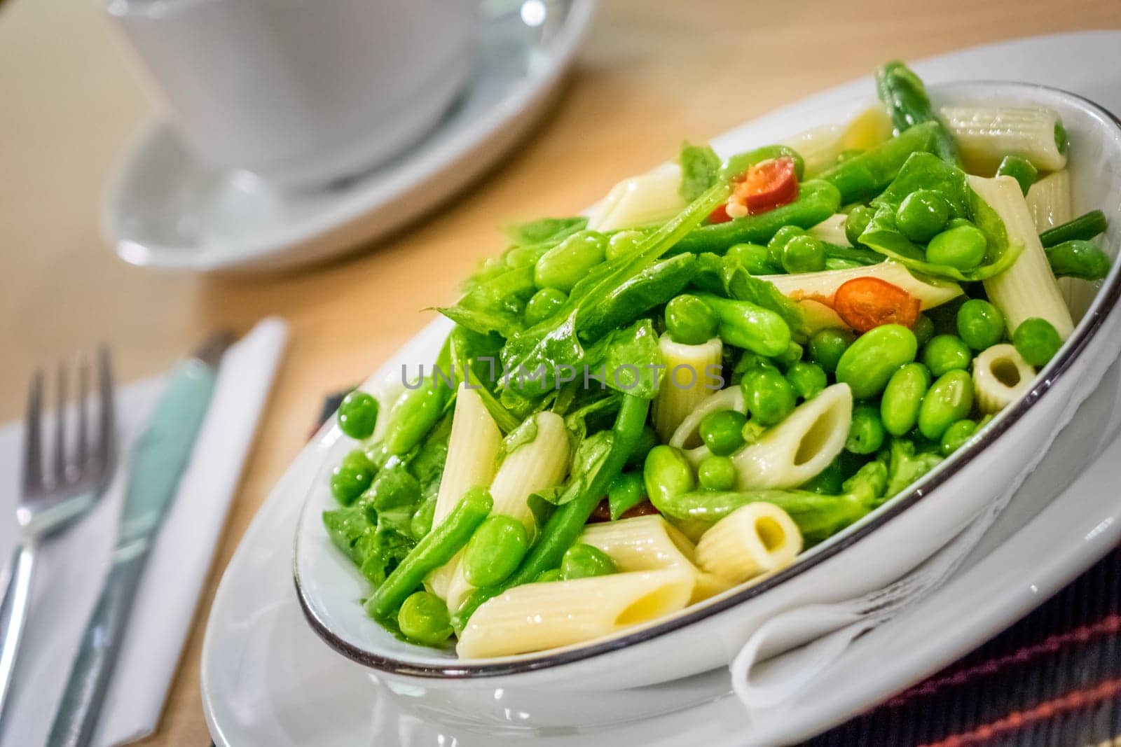 Close-up of freshly made green vegetables penne pasta