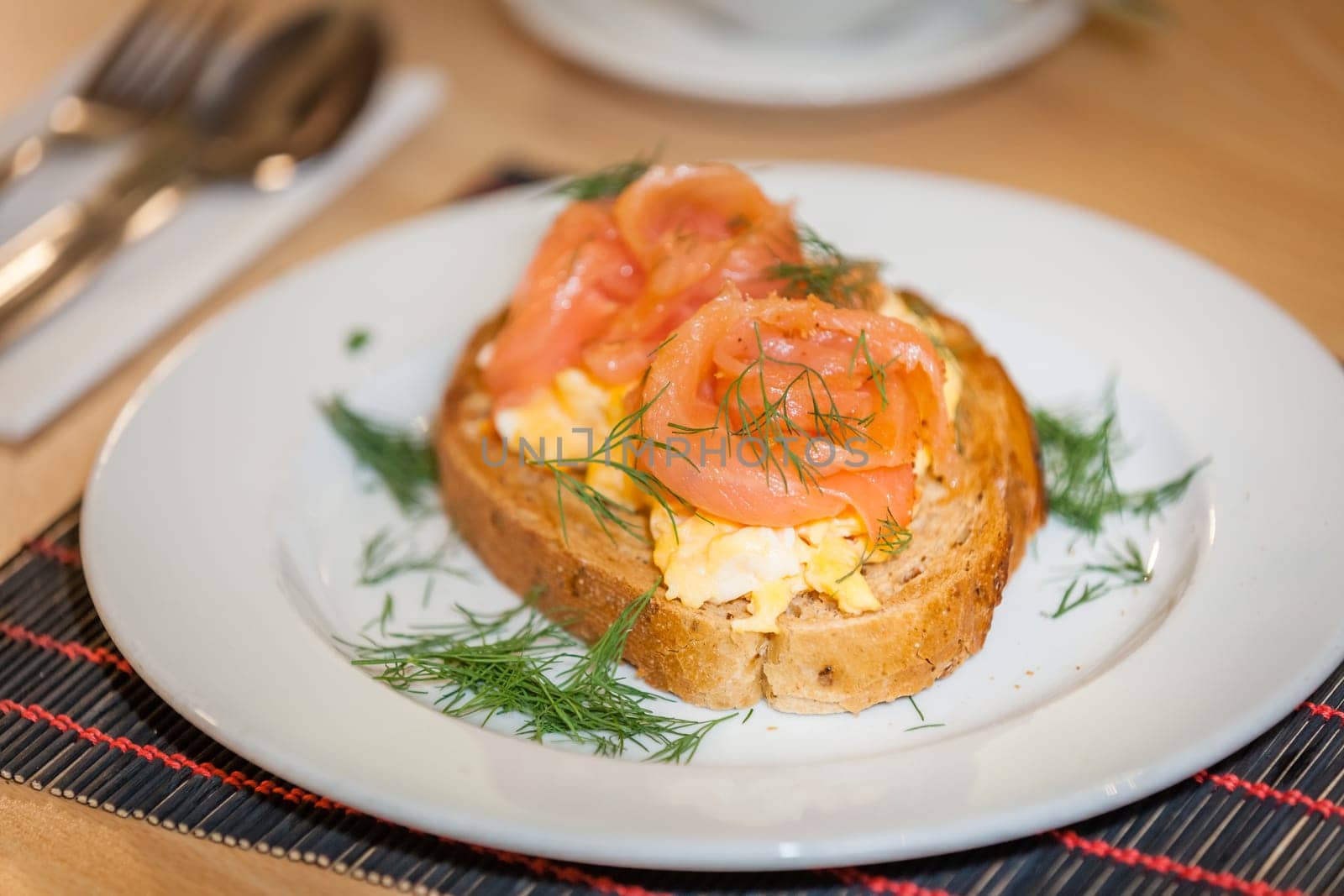 Smoked salmon with scrambled eggs on toast