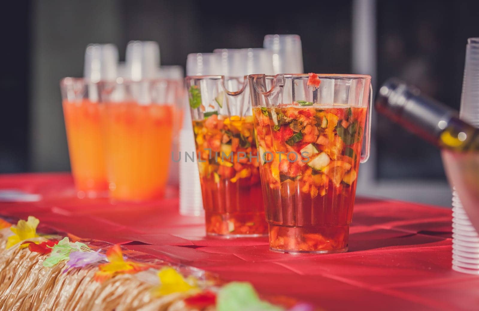Jugs containing alcoholic fresh fruit punch to be served for guests