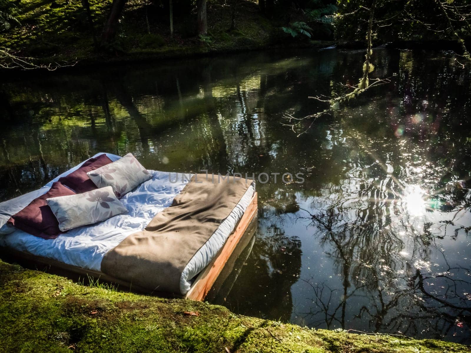 Double bed floating on the surface of a small lake in The Terra Nostra Garden in furnas,  on Sao Miguel island, Azores, Portugal