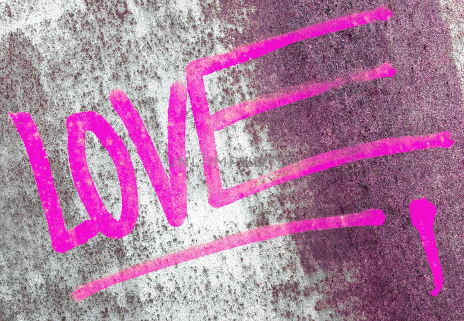 Word LOVE written over the grunge rusty background