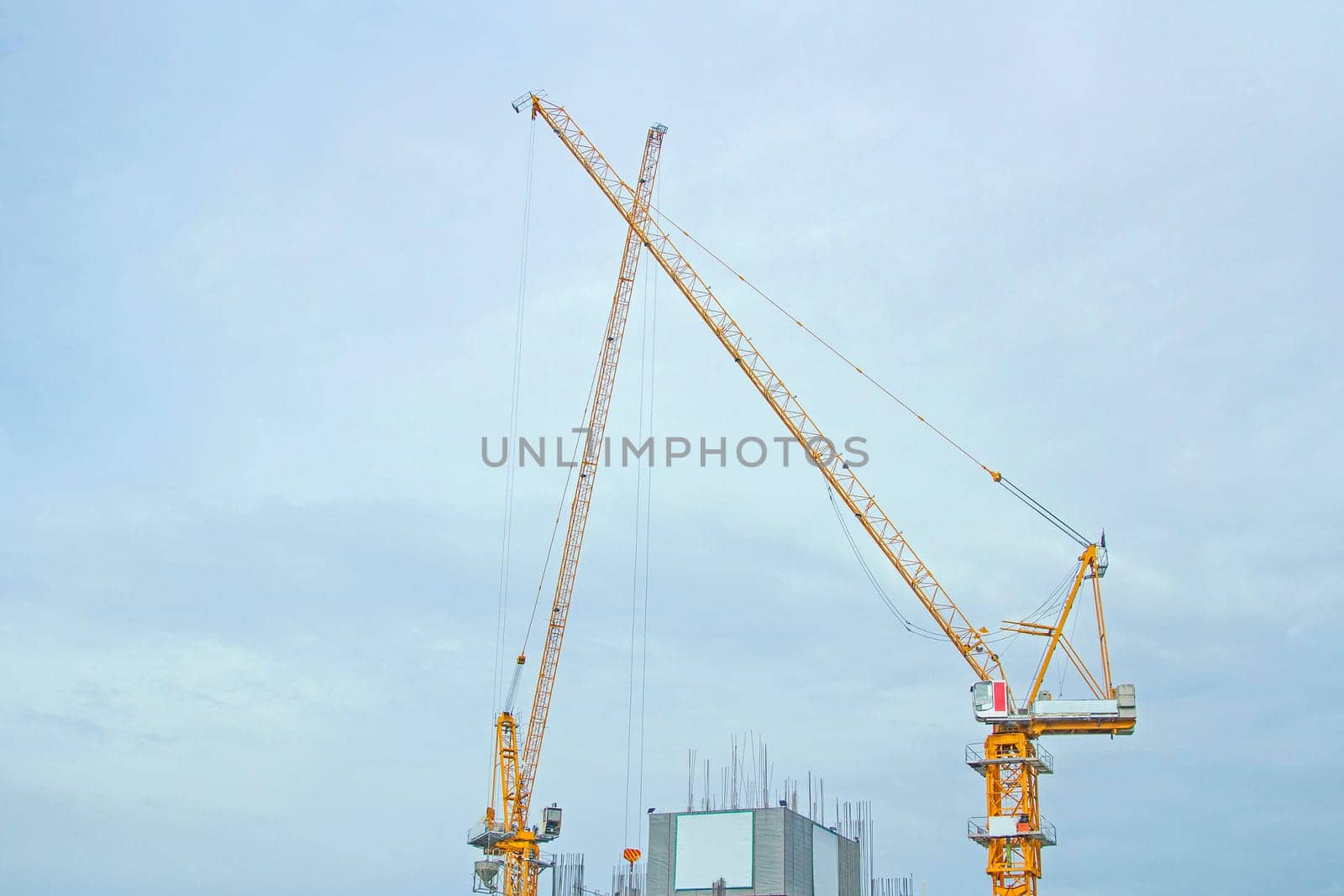 Building site with cranes and blue sky