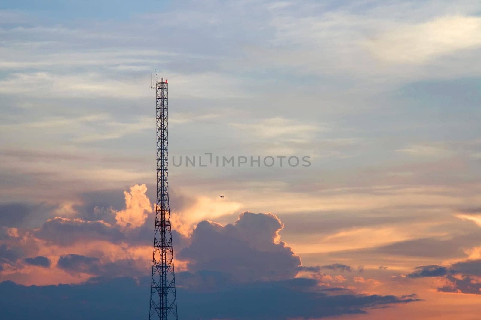 Mobile phone communication tower transmission  signal  leash in evening sky