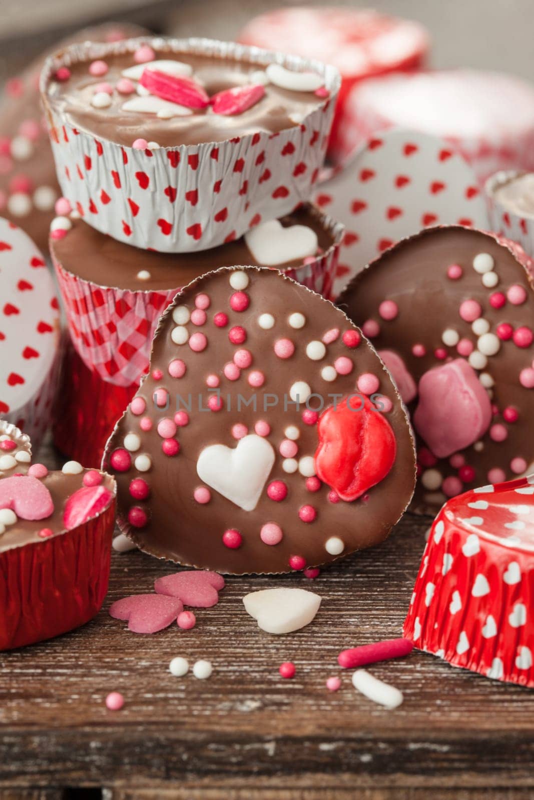 Homemade confectionery with sugar sprinkles in small heart tubes made of aluminium