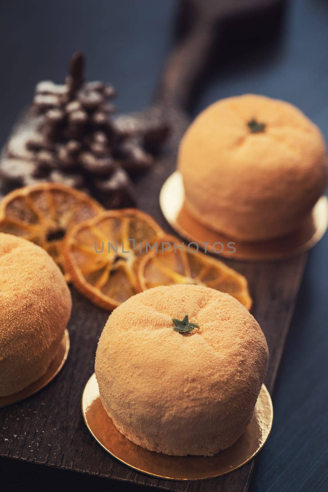Tasty dessert as orange fruit with chocolate fir-tree for new year holiday