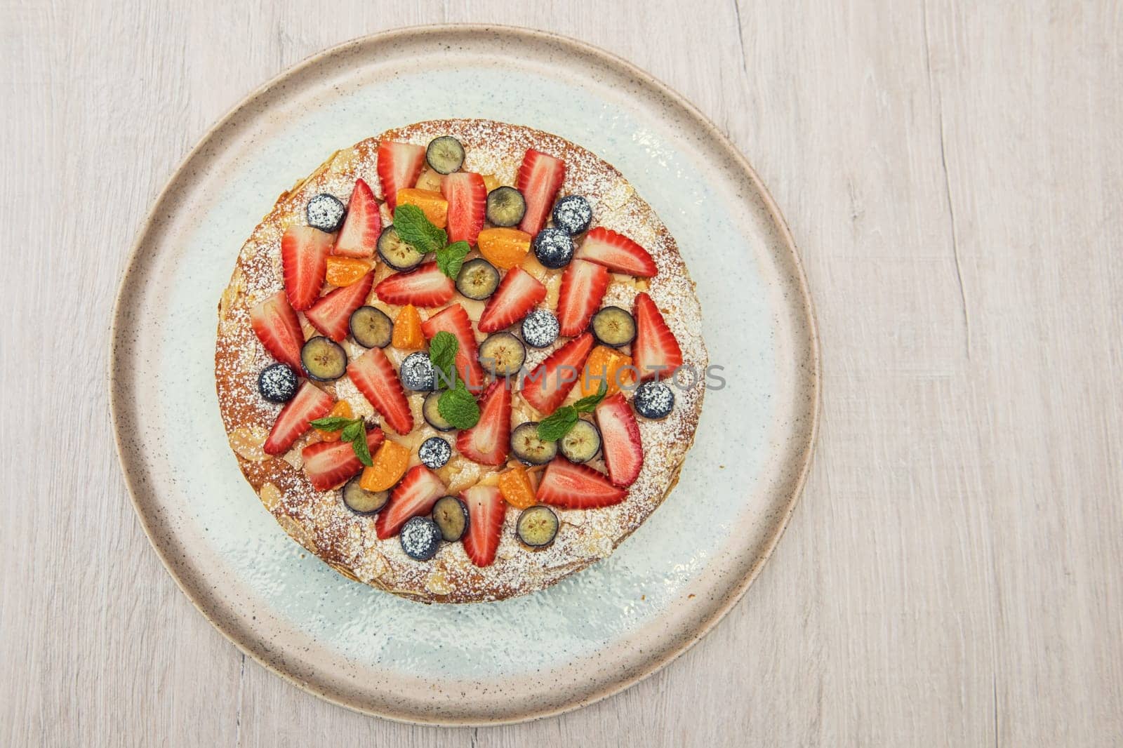 Sweet bright cakes with fruit and berries