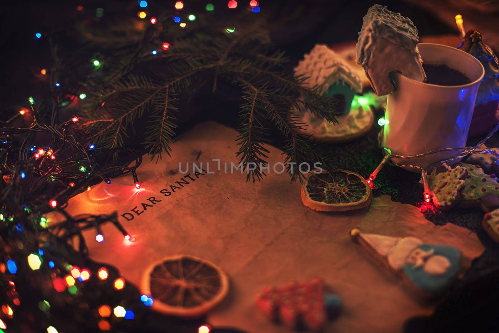 Letter for Santa on decorated chrismas background with gingerbread coocies and garland