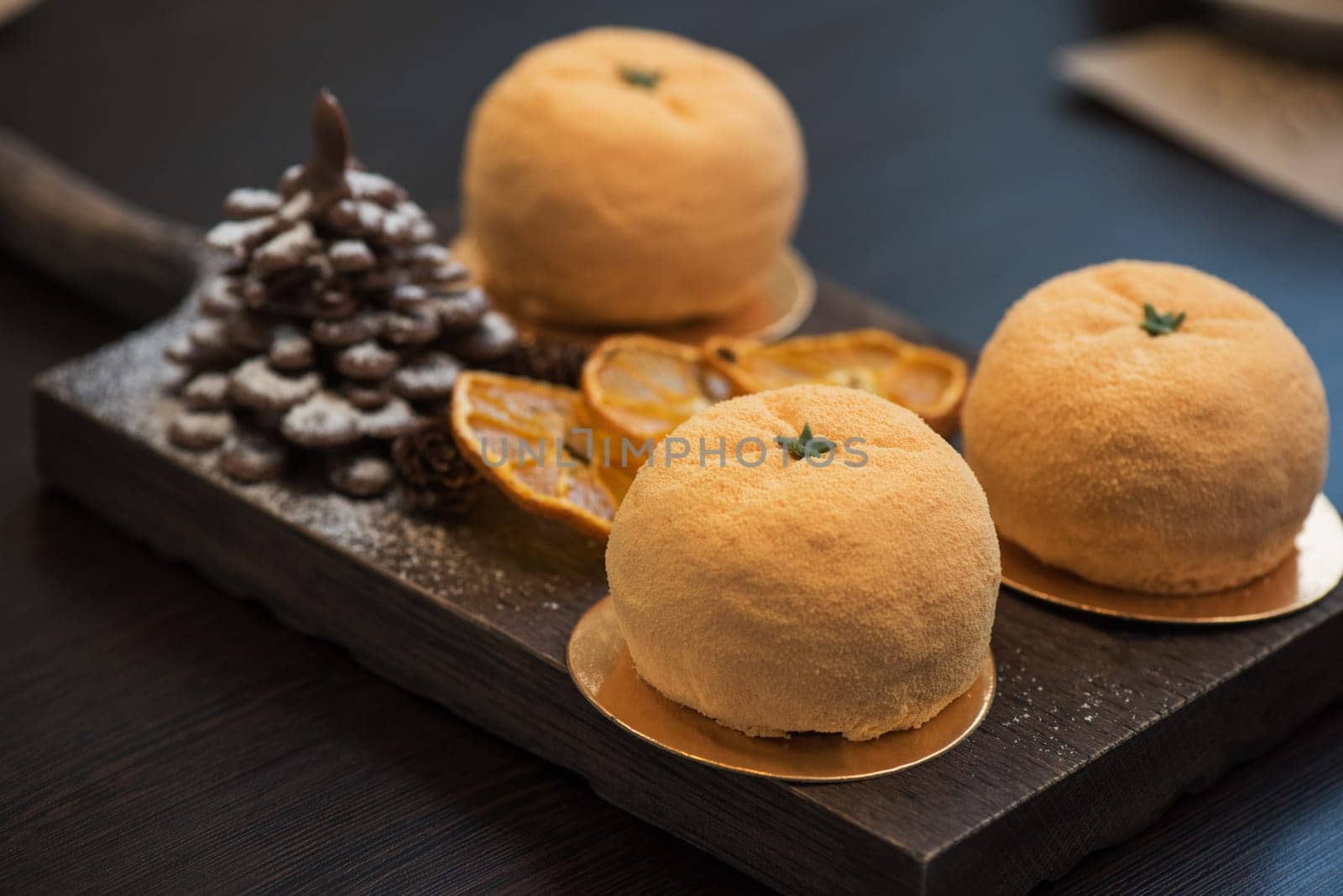 Tasty dessert as orange fruit with chocolate fir-tree