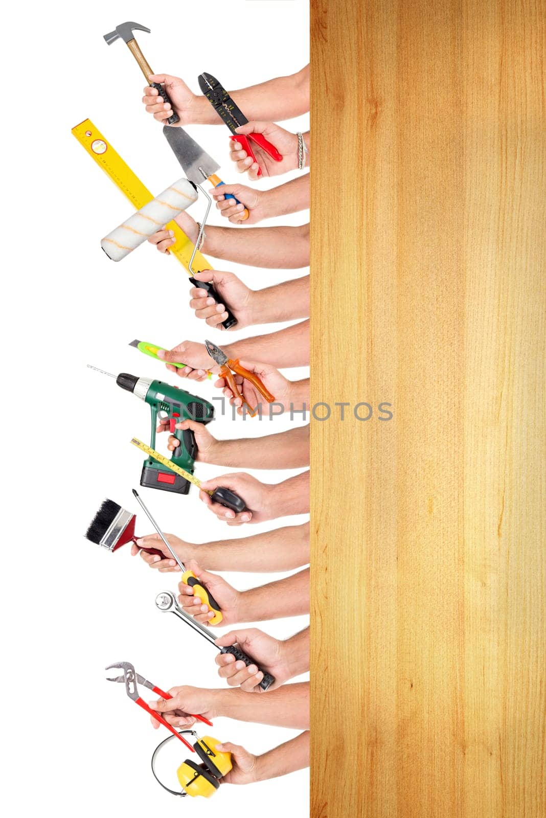 Several hands together with different construction tools