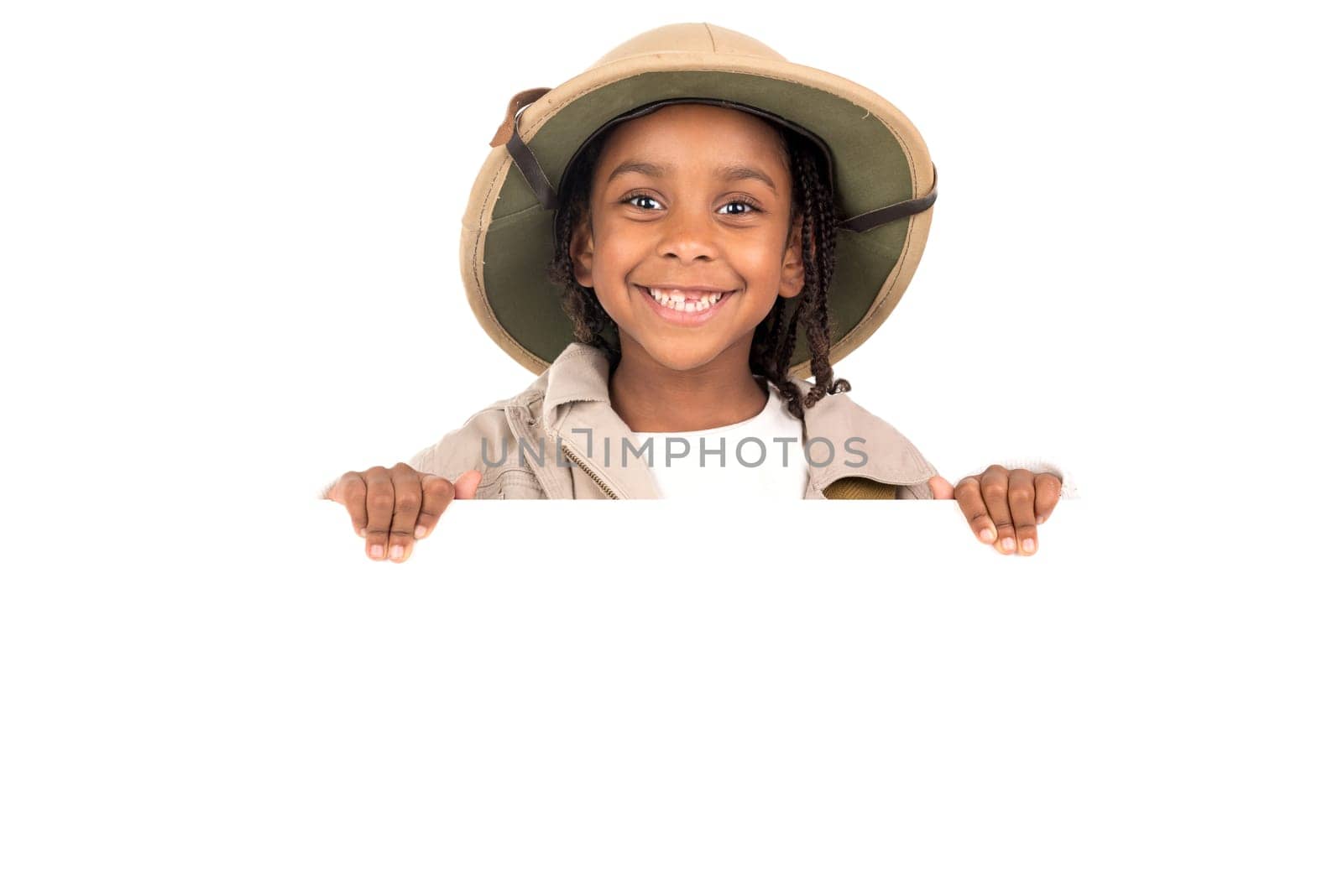 Young girl with Safari clothes behind a white board isolated in white