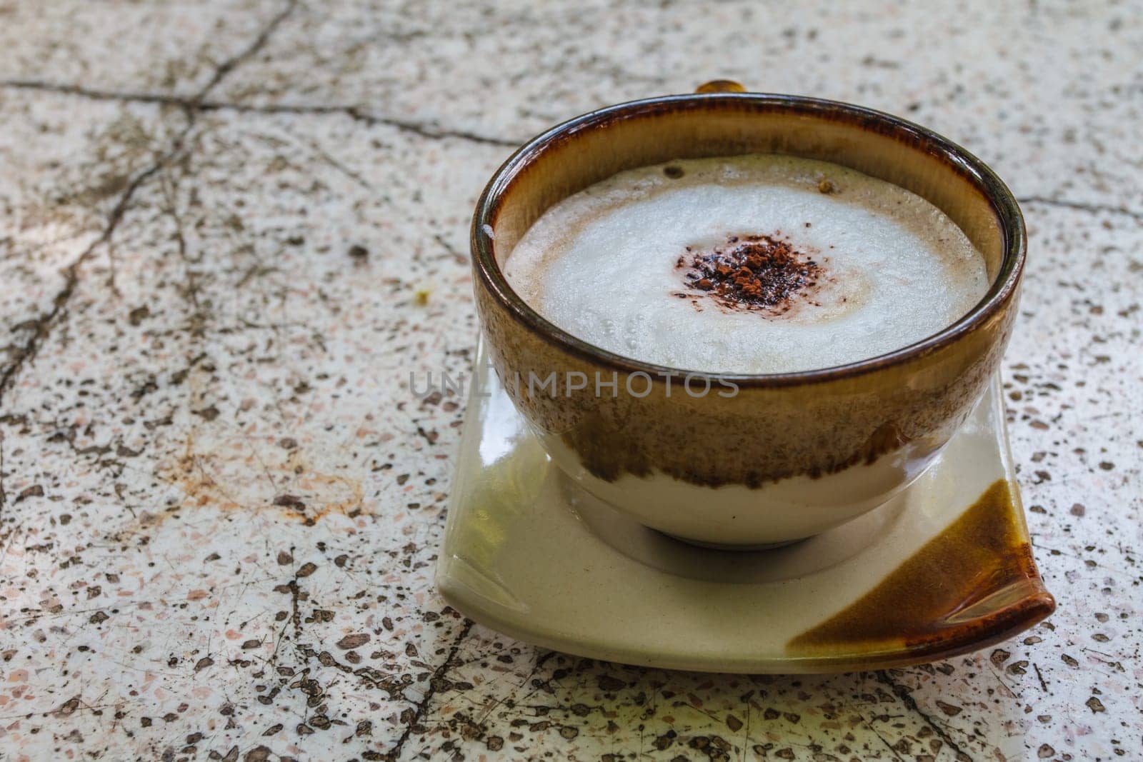 Close up cappuccino coffee on marble table