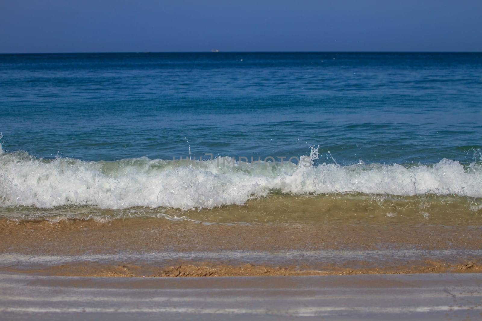 Moving of surf in the sea,Soft wave of the sea on the sandy beach