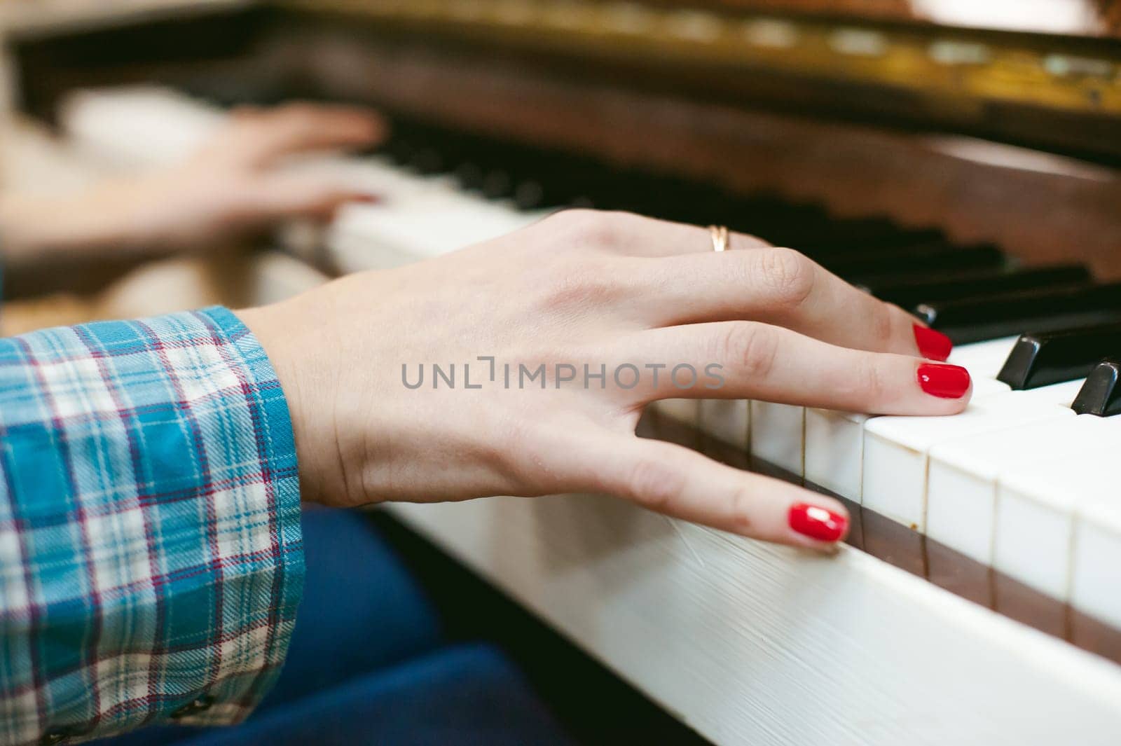 hipster girl playing a vintage white piano