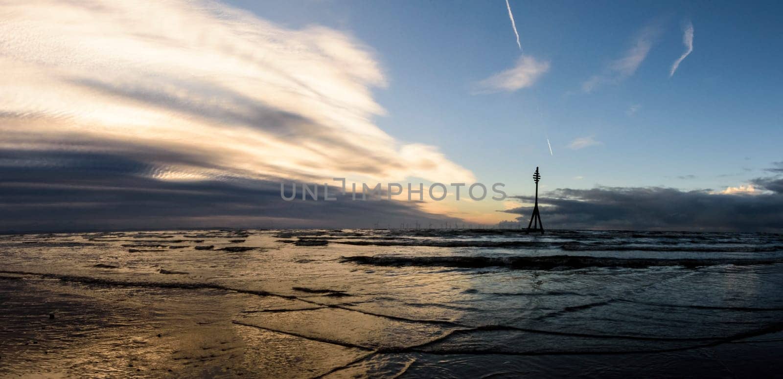 Sunset on Crosby Beach in winter - Crosby, Liverpool, United Kingdom