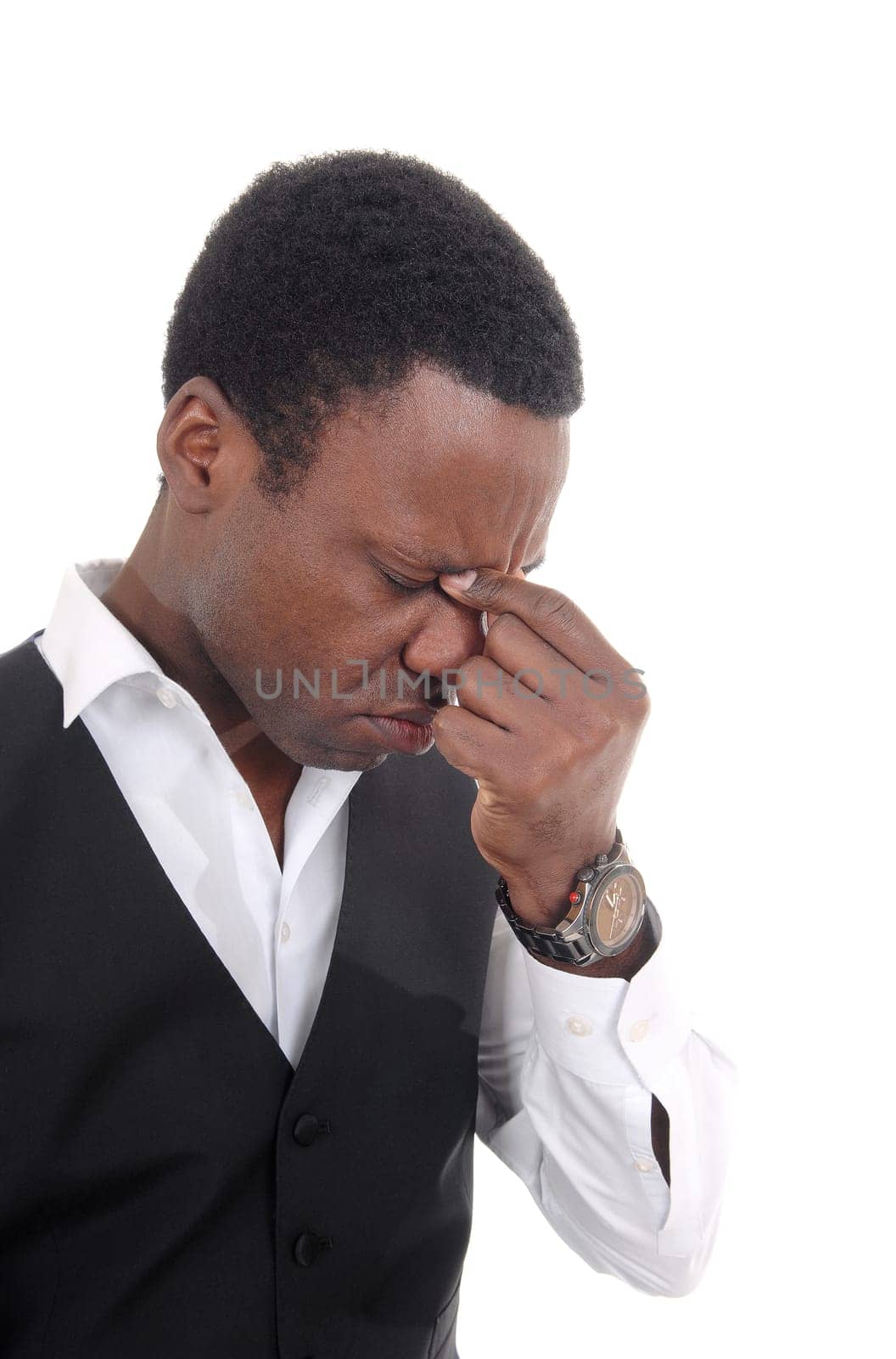 A frustrated African American man in a vest with his hand on his face.looking down in depression, isolated for white background.
