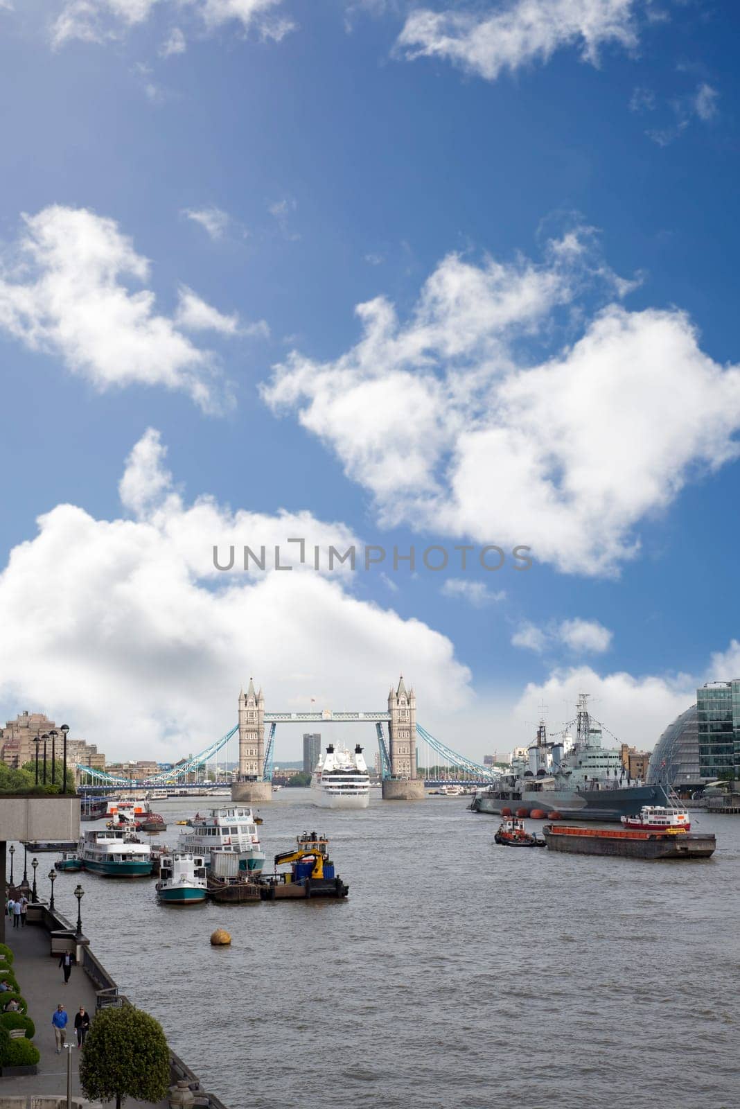 cruise liner departing london under tower bridge
