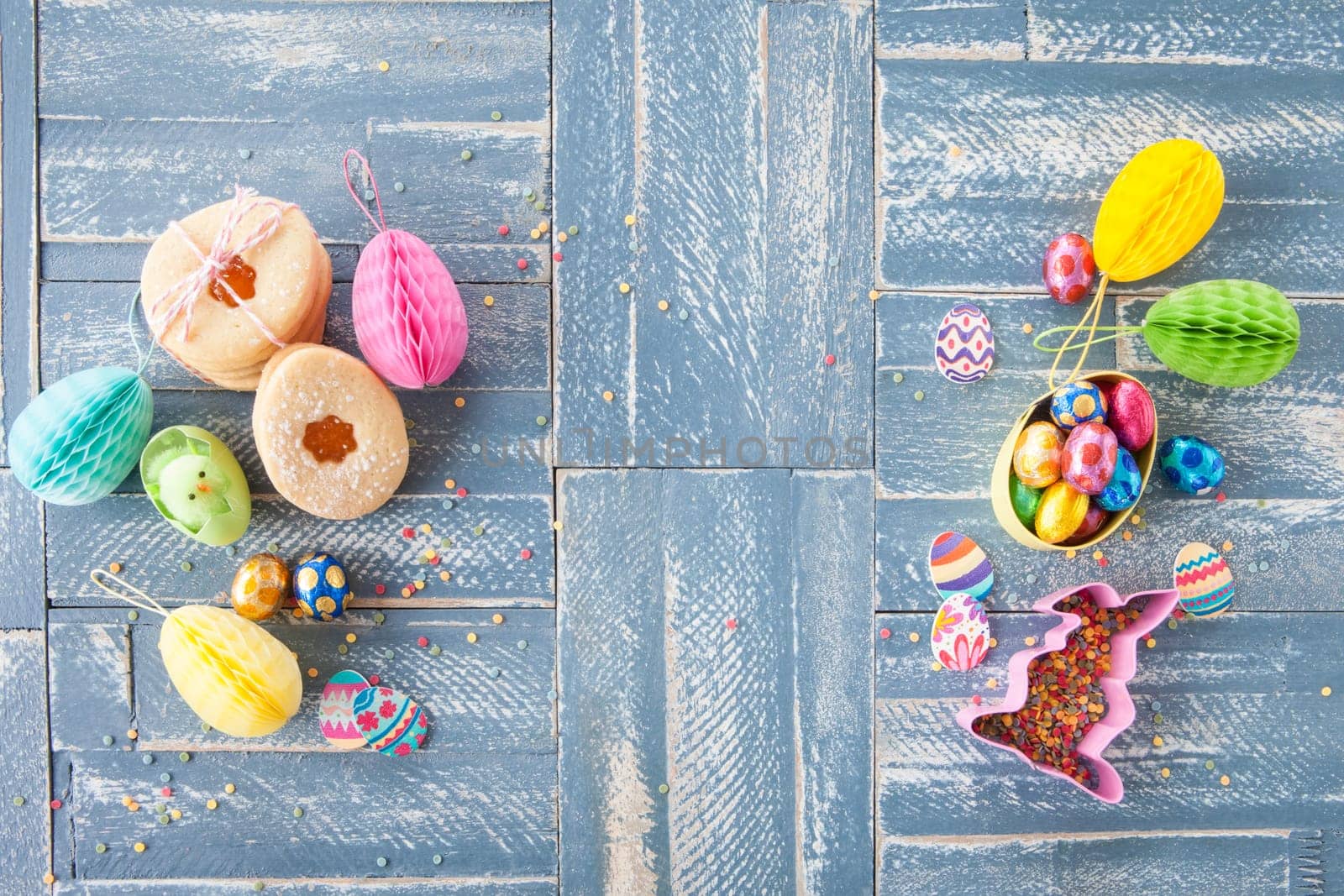 Colorful sweets at Easter on a rustic wooden background