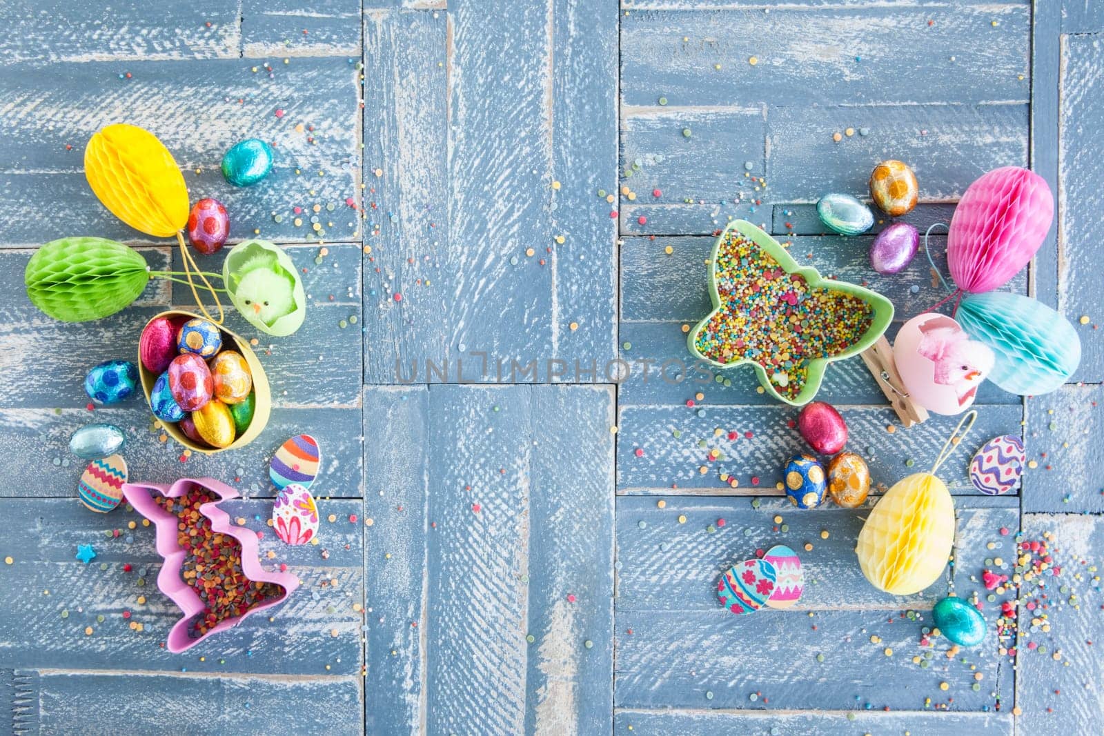 Colorful sweets at Easter on a rustic wooden background