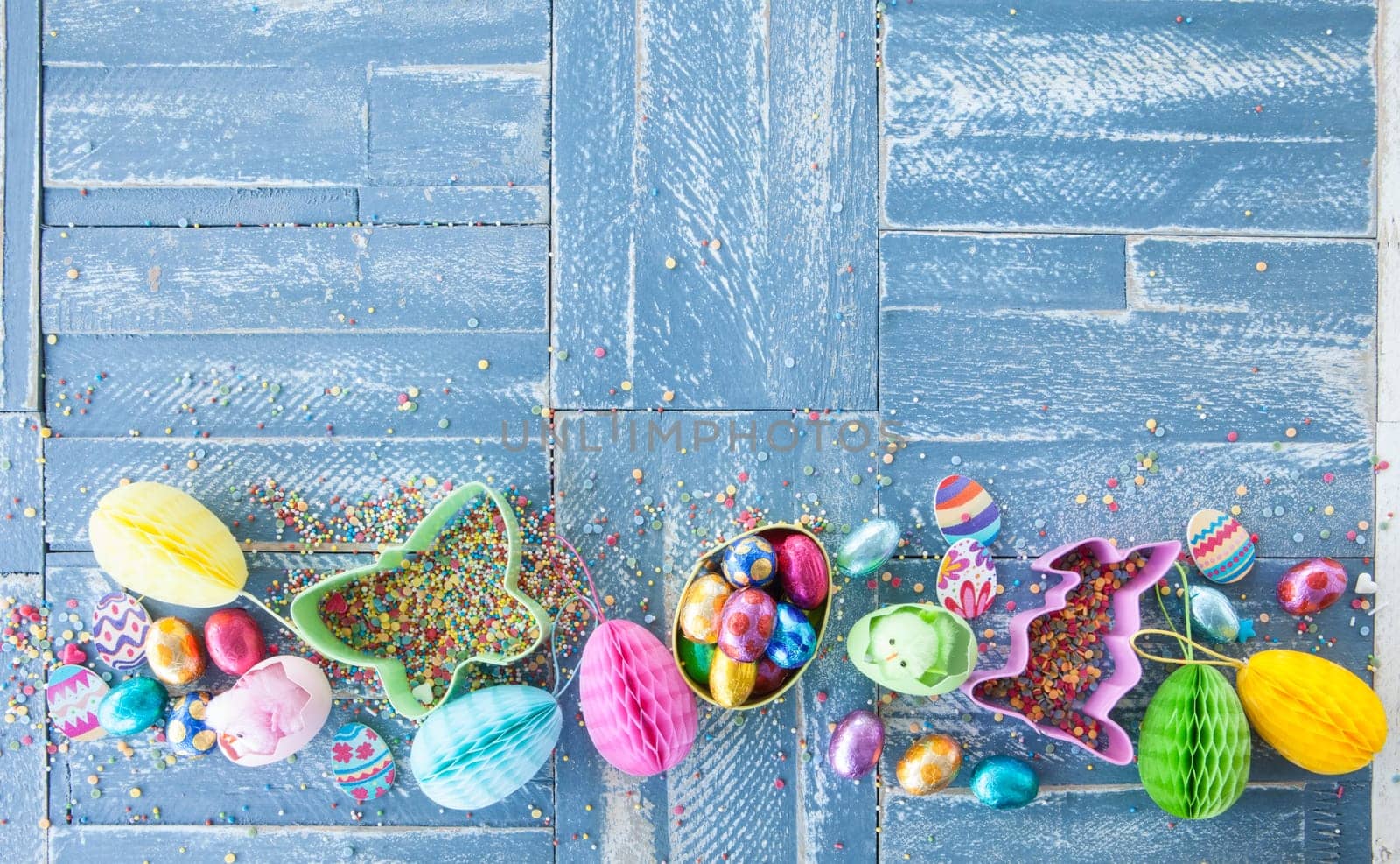 Colorful sweets at Easter on a rustic wooden background
