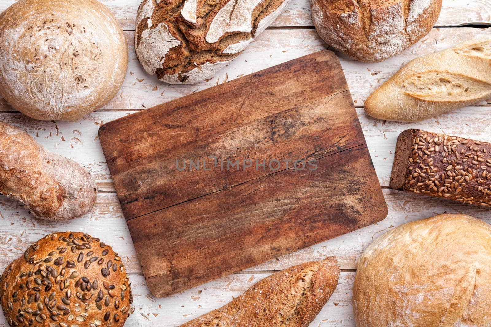 Delicious freshly baked bread on wooden background