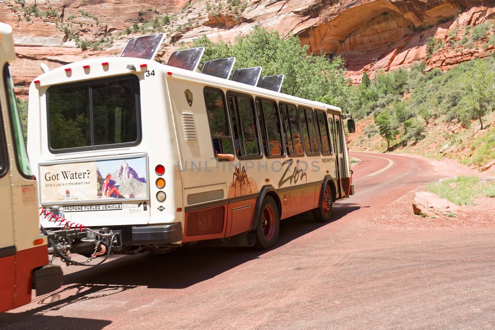 Springdale, Utah, USA - June 3, 2015: Zion Park Bus transports tourists inside the park at the Lodge. Zion National Park, Utah.