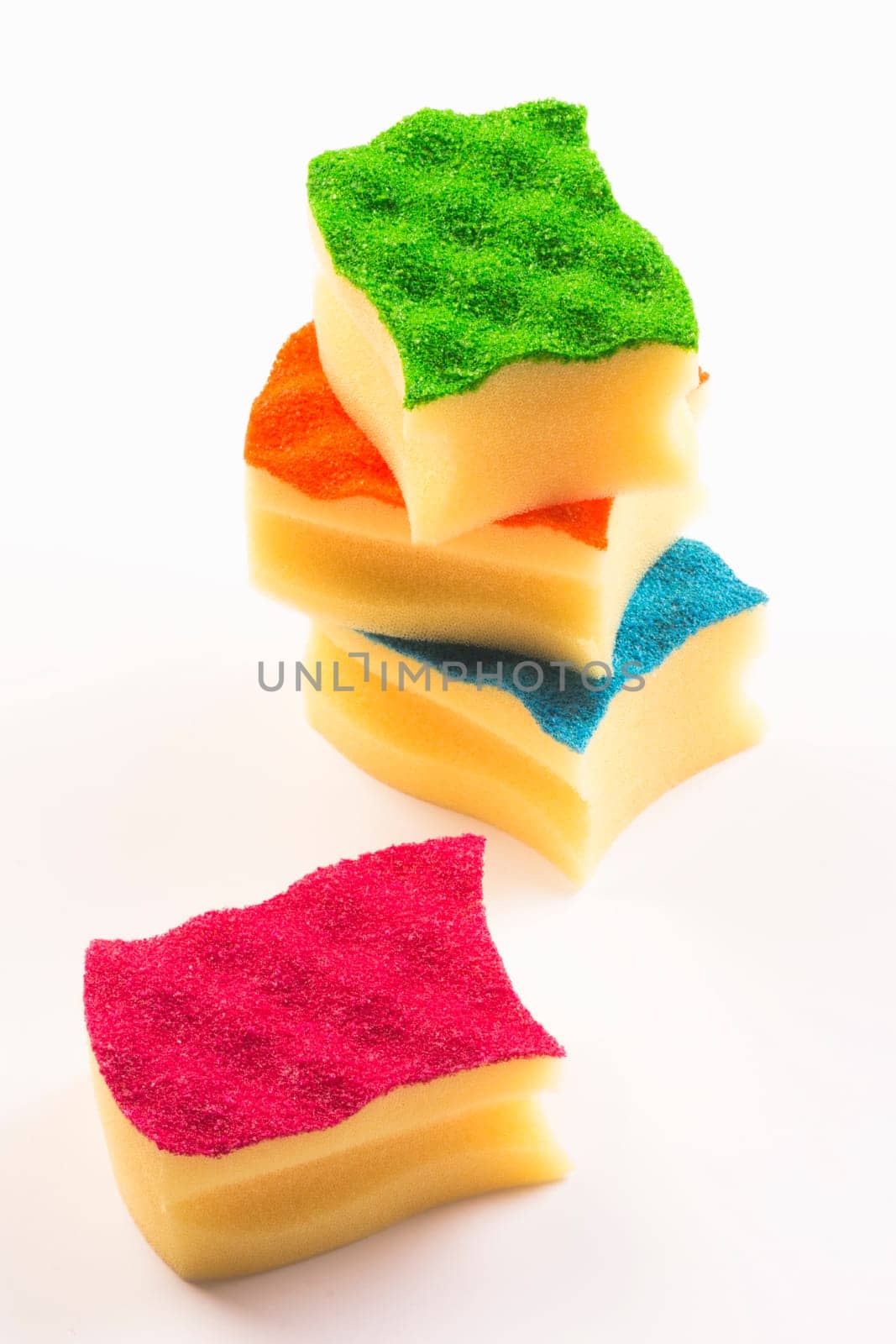 Colorful four sponges are on white background.