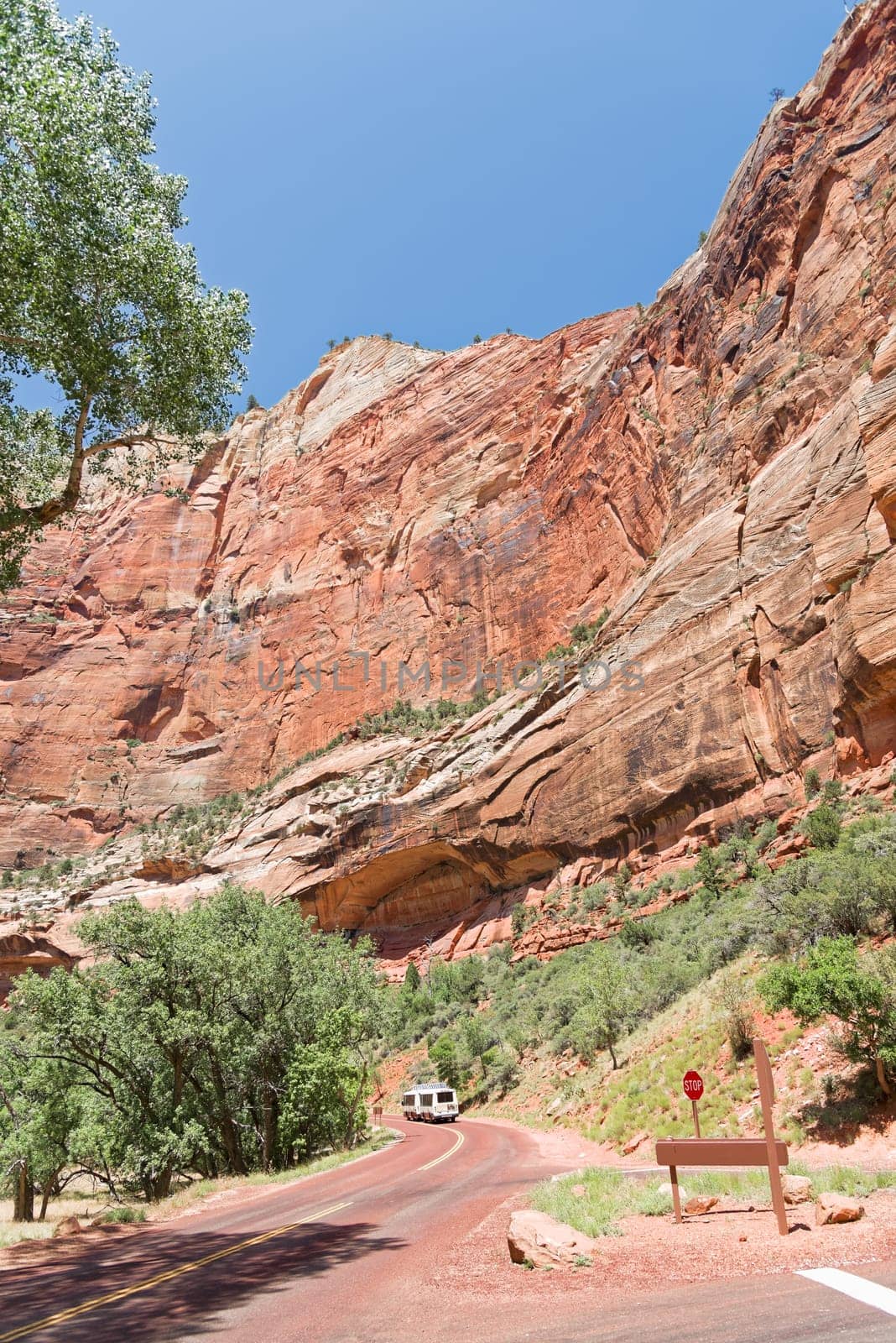 Springdale, Utah, USA - June 3, 2015: Zion Park Bus transports tourists inside the park at the Lodge. Zion National Park, Utah.