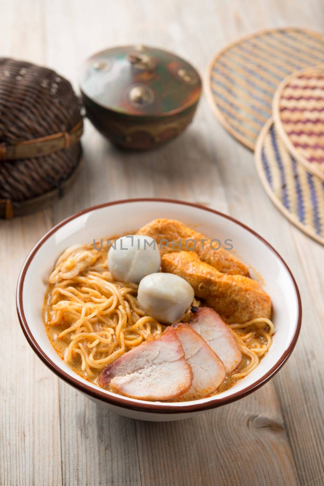Hot and spicy curry noodle on the table. One of the popular foods in Asia.