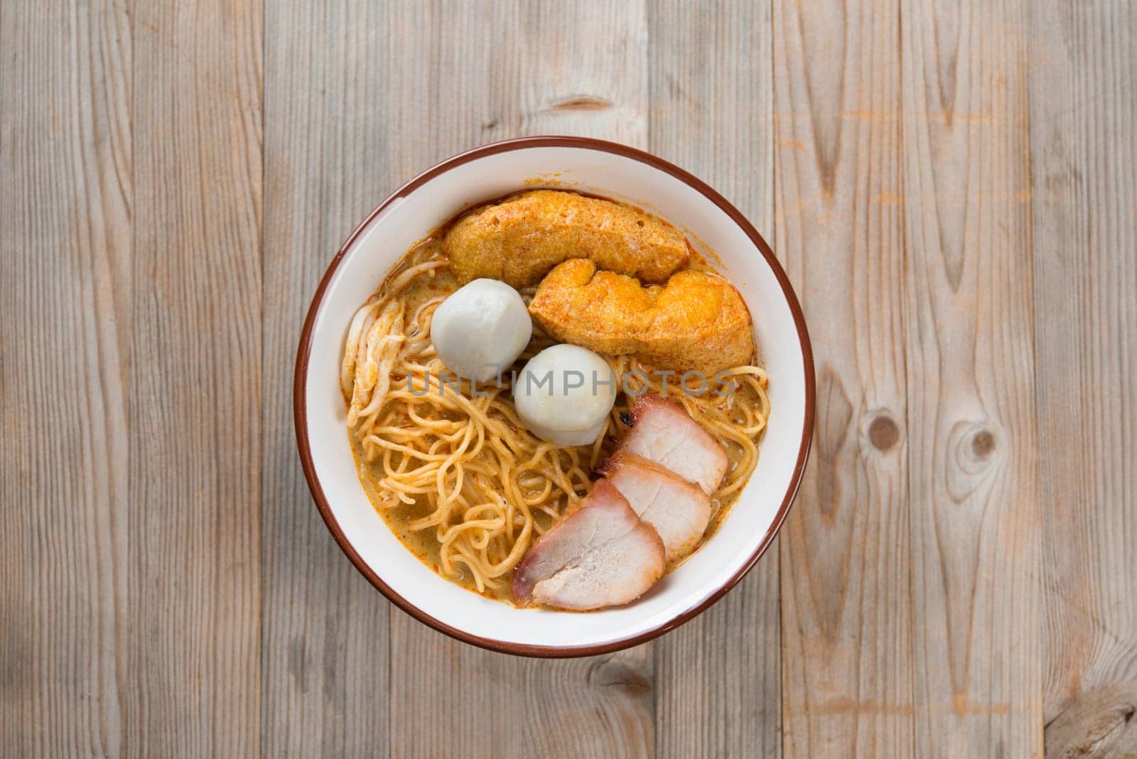 Top view Curry Laksa, which is a popular traditional spicy noodle soup from the culture in Malaysia.