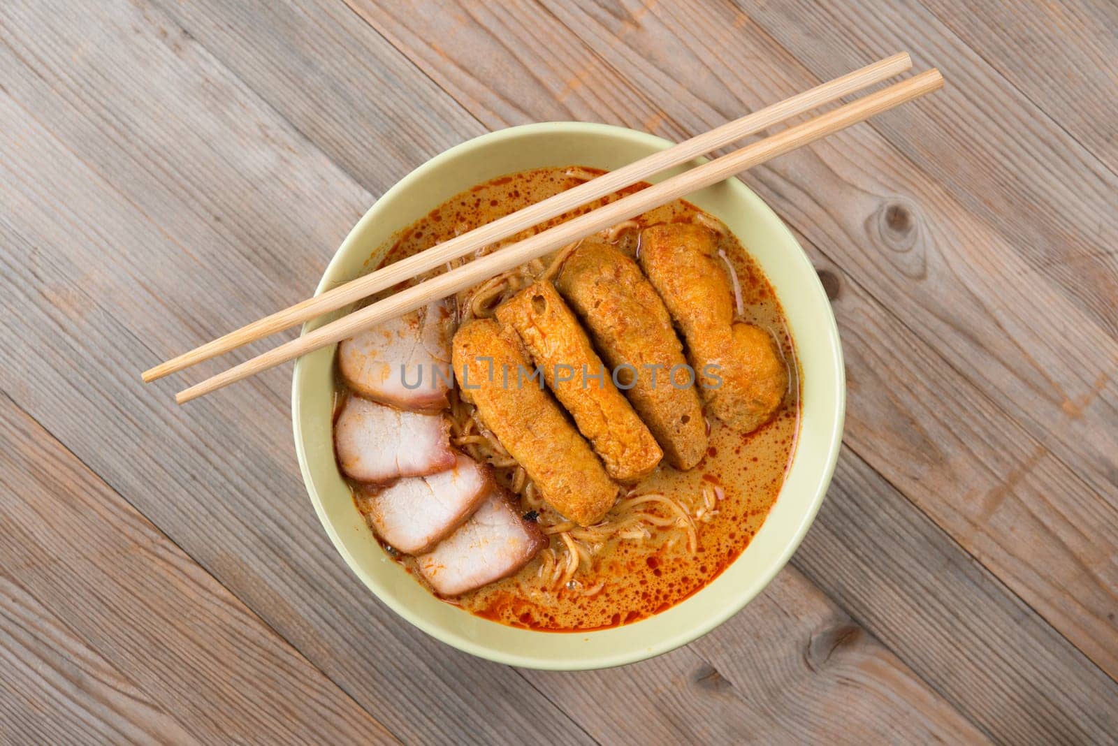 Top view Curry laksa, a popular spicy dish in Malaysia cuisine.
