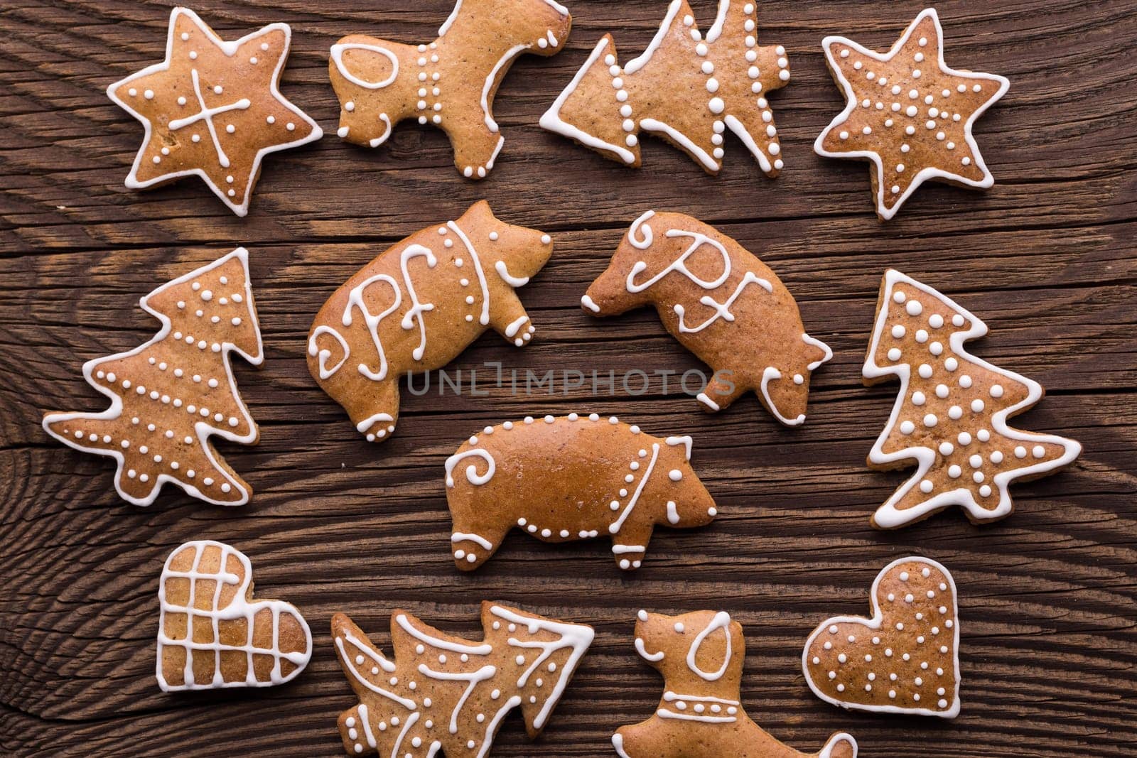 Gingerbread Christmas cookie background. Christmas homemade gingerbread cookies on wooden background.