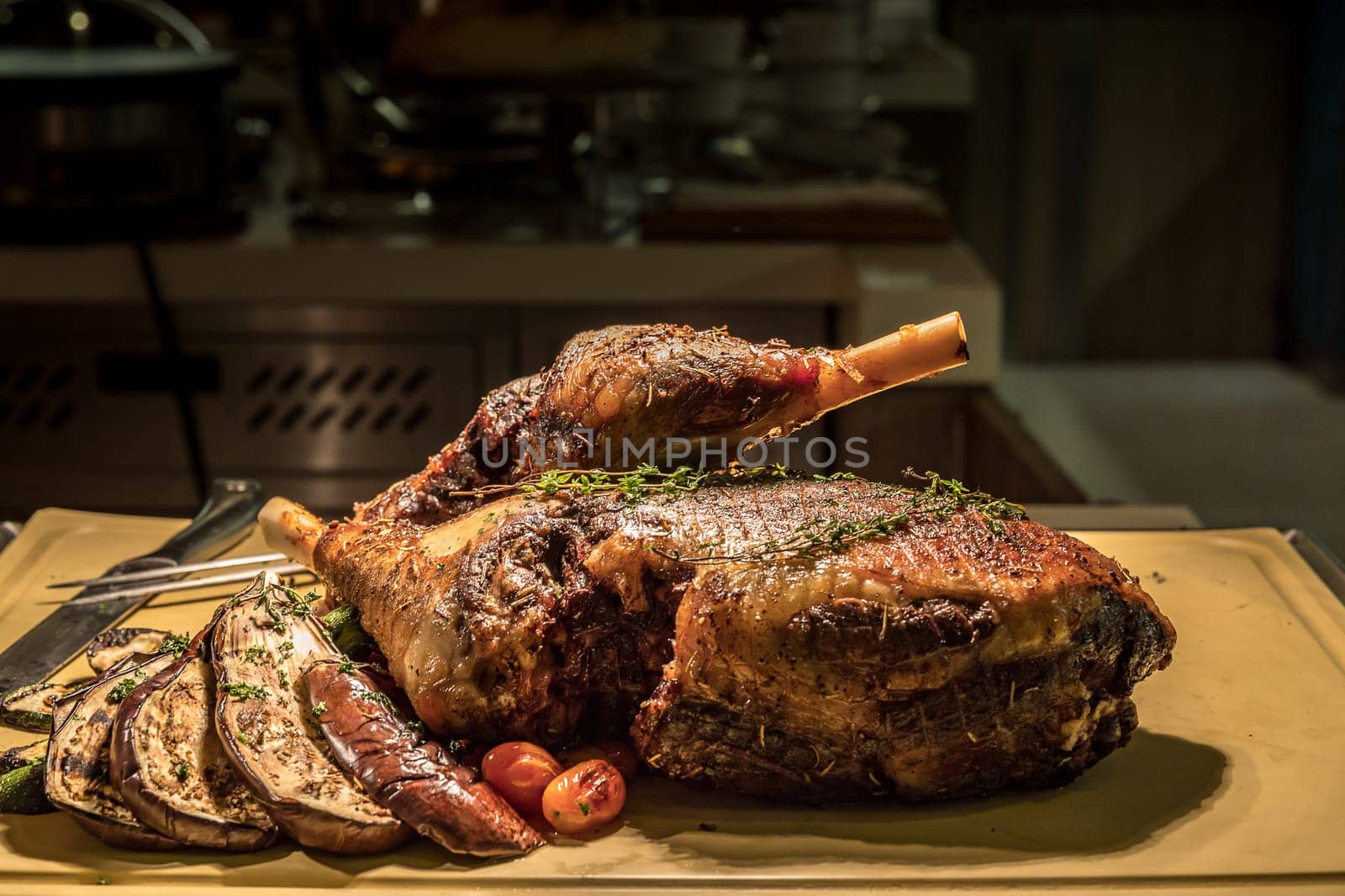 Carving of Roasted lamb meat