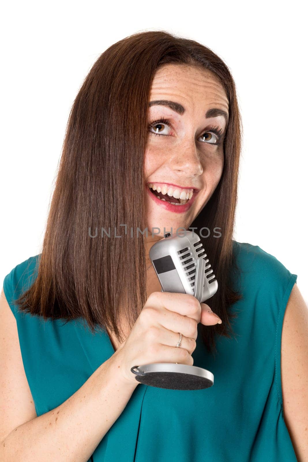 Casual young woman with a microphone isolated in a white background